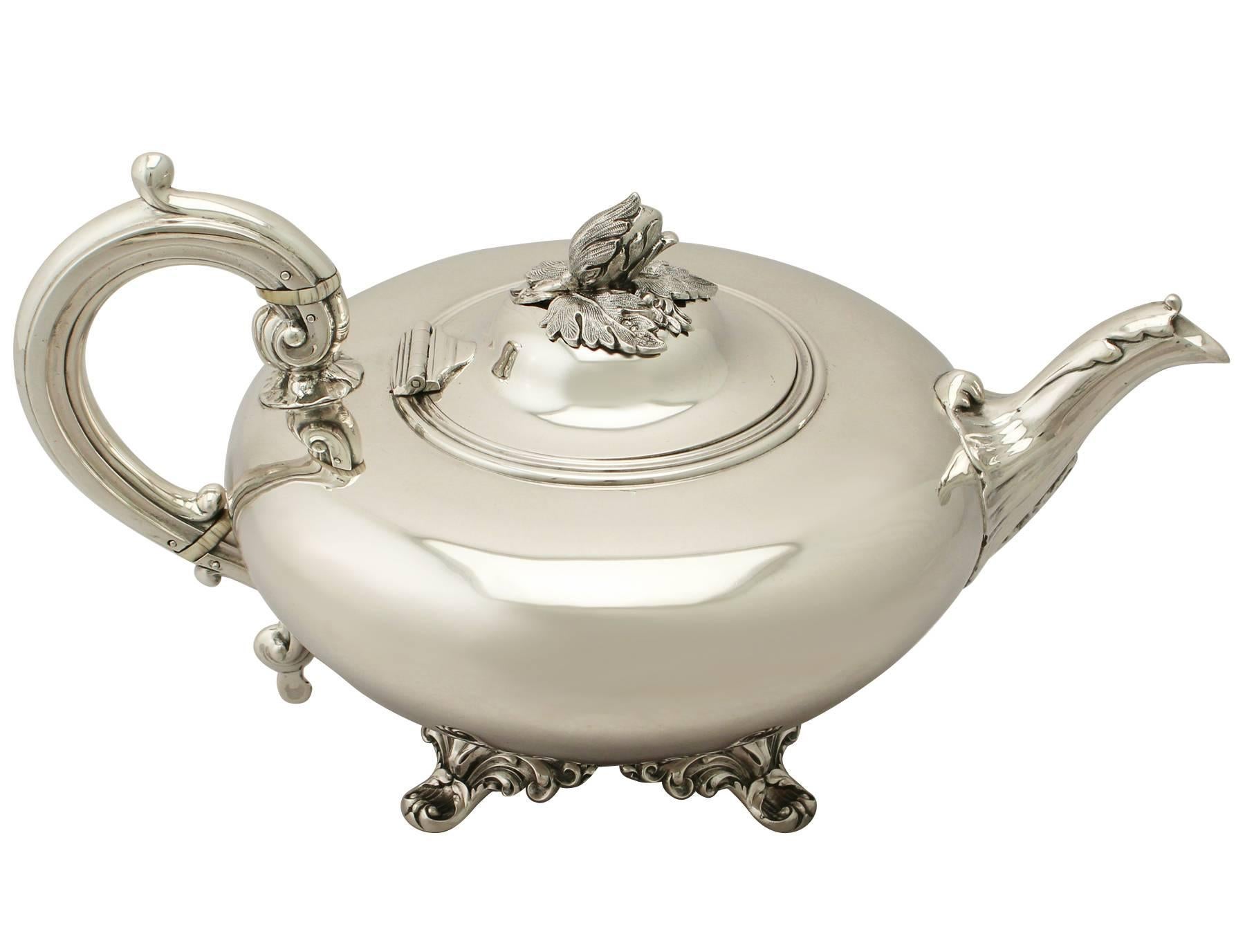 An exceptional, fine and impressive antique Victorian English sterling silver teapot; an addition to our silver teaware collection.

This exceptional antique Victorian sterling silver teapot has a circular compressed rounded form.

The body of