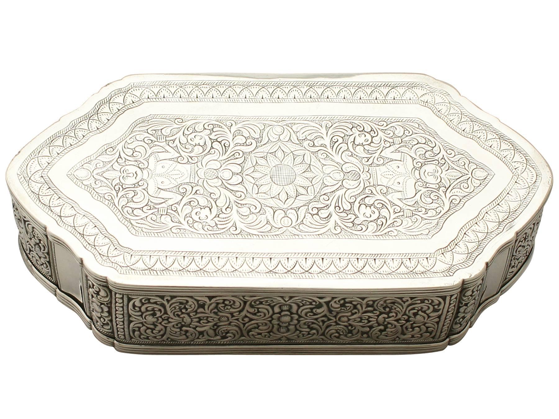 A fine and impressive antique Indian silver box; an addition to our diverse Asian silverware collection.

This fine antique Indian silver box has an irregular hexagonal shaped form with one line of symmetry and shaped rounded ends.

The body of