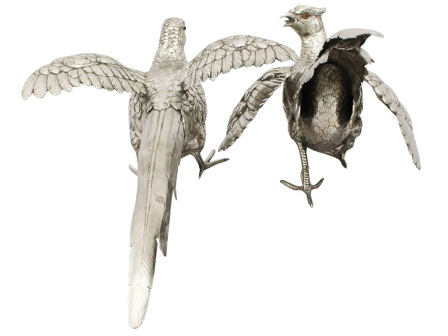 A magnificent, fine and impressive large pair of vintage German sterling silver table pheasants; part of our continental ornamental silverware collection.

These magnificent antique cast German silver table ornaments have been realistically modelled