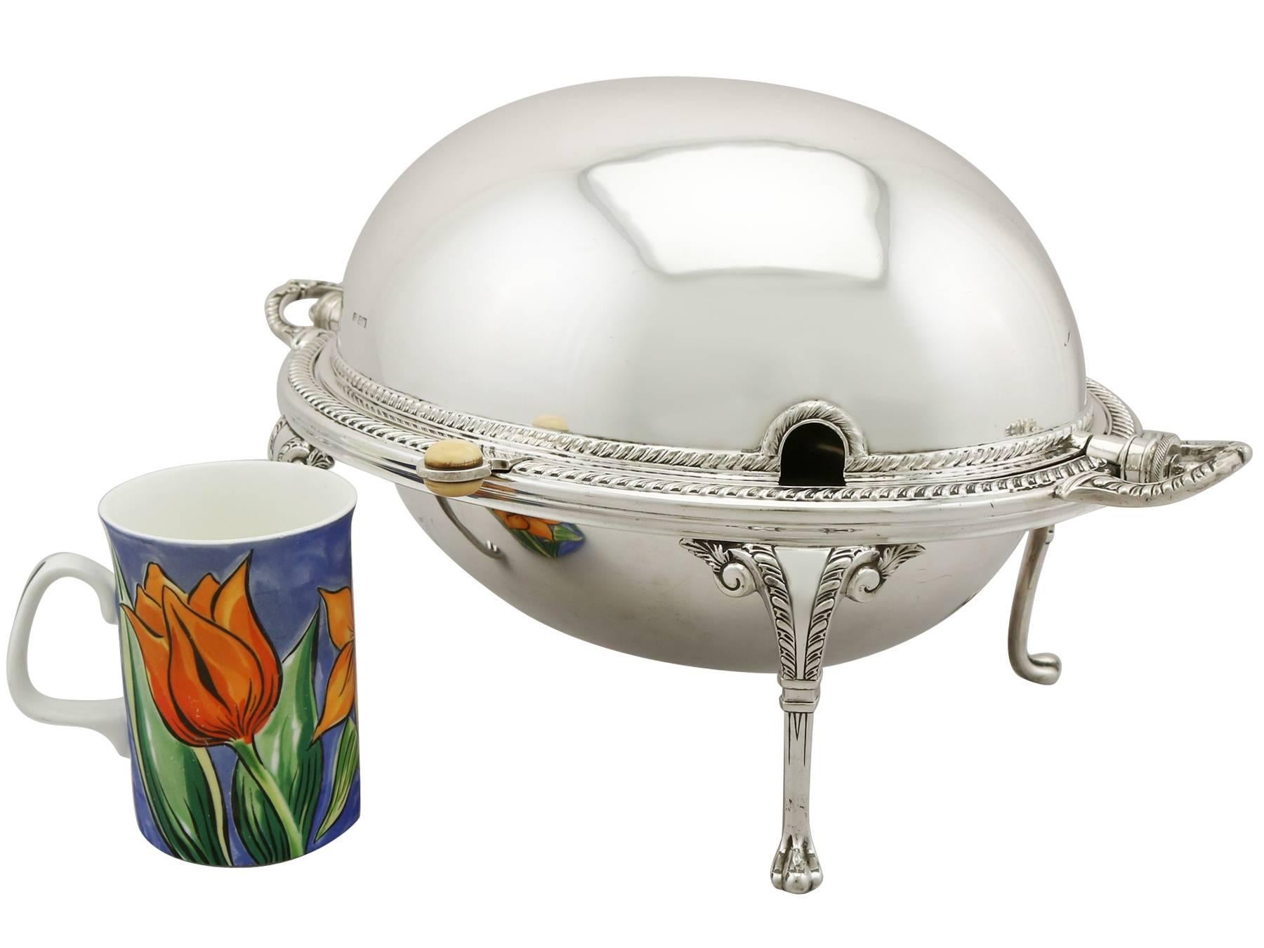 An exceptional, fine and impressive antique Edwardian sterling silver revolving breakfast dish; an addition to our silverware collection.

This exceptional antique Edwardian sterling silver breakfast dish has an oval domed shaped form.

The