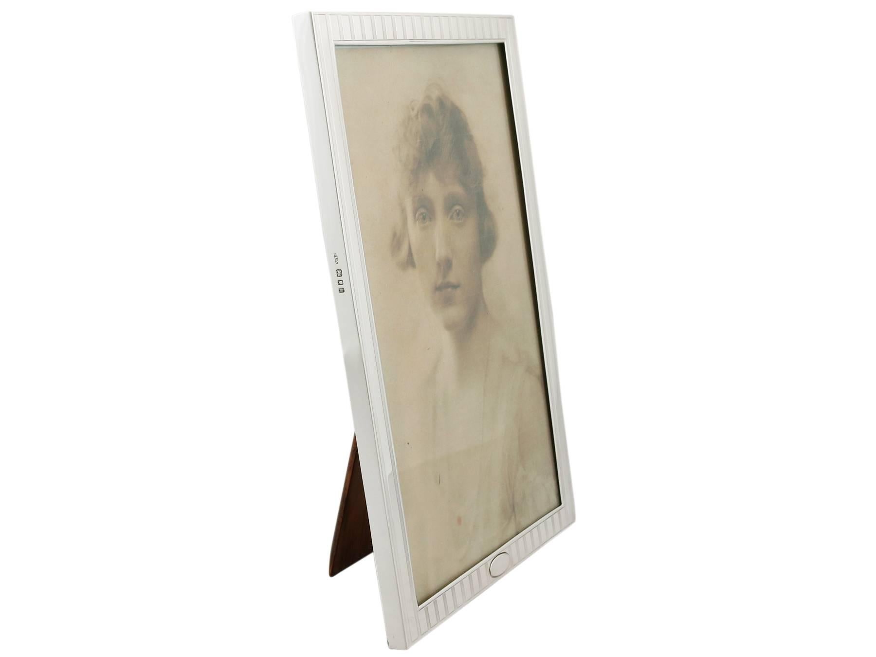 An exceptional, fine and impressive antique George V English sterling silver photograph frame; an addition to our ornamental silverware collection.

Description

This exceptional antique George V sterling silver photo frame has a plain