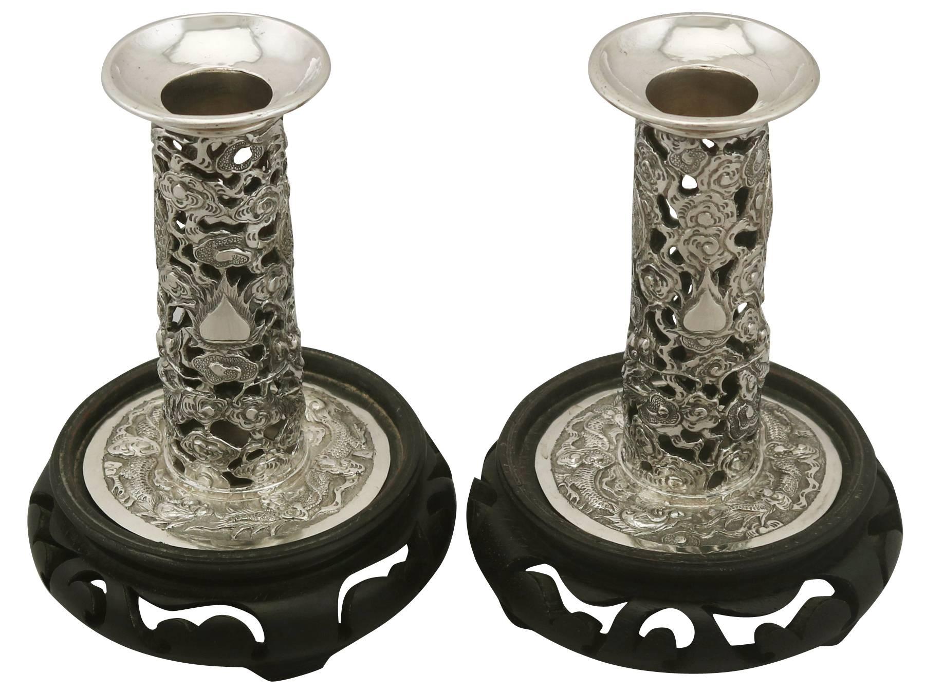 An exceptional, fine and impressive pair of antique Chinese Export silver candlesticks; an addition to our ornamental silverware collection

These exceptional antique Chinese Export silver (CES) candlesticks have a cylindrical shaped column to a