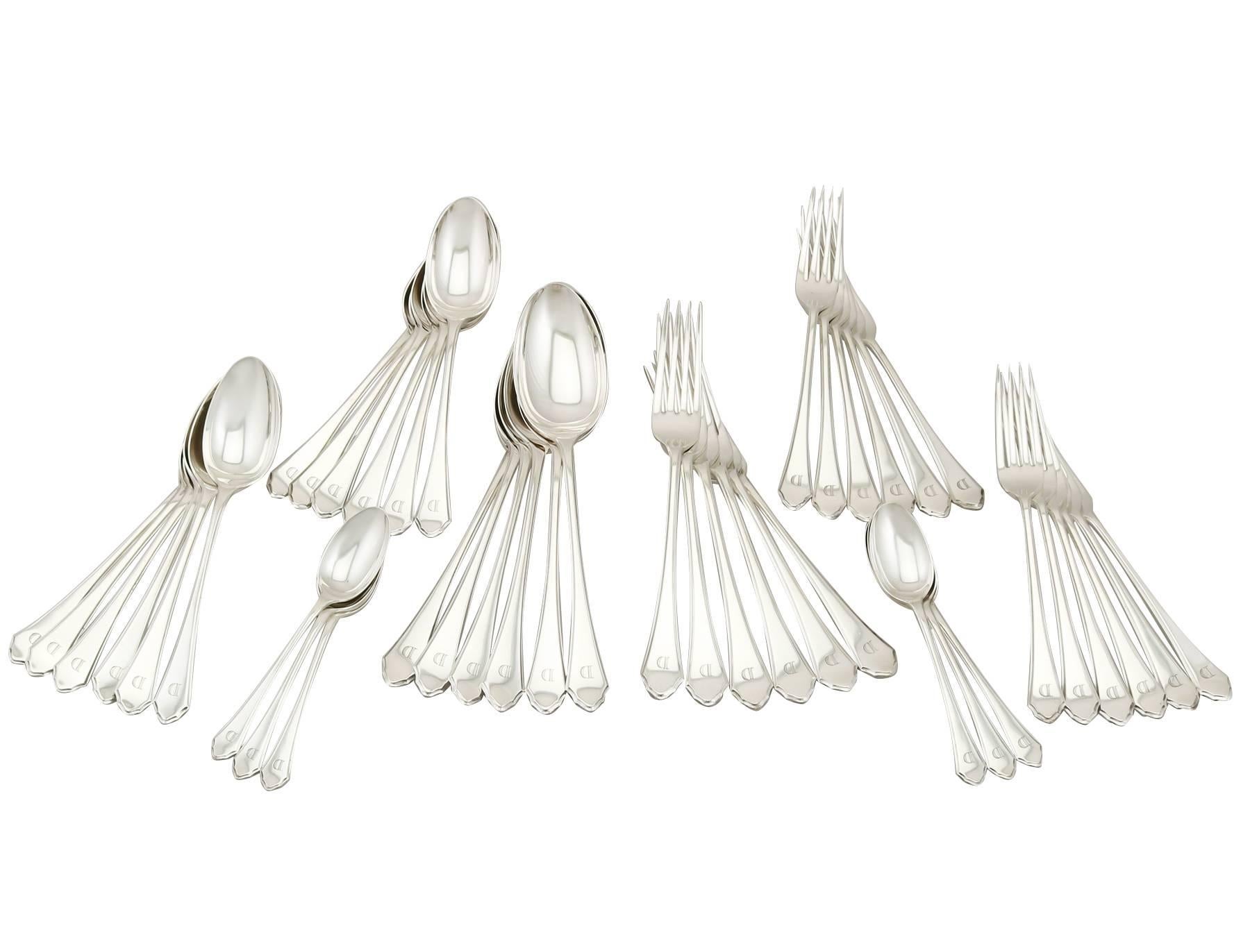 An exceptional, fine and impressive, comprehensive antique George V English sterling silver straight Pembury pattern flatware service made in the Art Deco style; an addition to our canteen of cutlery collection.

The pieces of this exceptional and