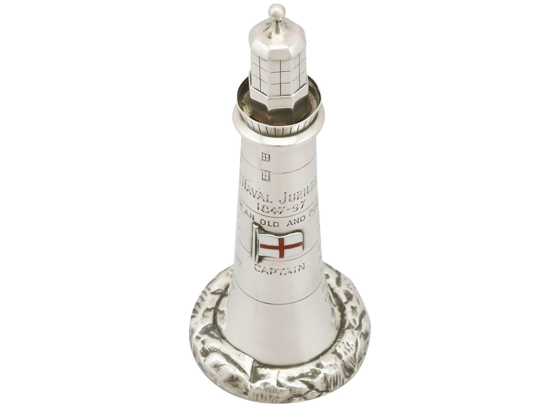 An exceptional, fine and impressive antique Victorian English sterling silver and enamel table lighter modelled in the form of a lighthouse; an addition to our maritime silverware collection.

This exceptional antique Victorian sterling silver
