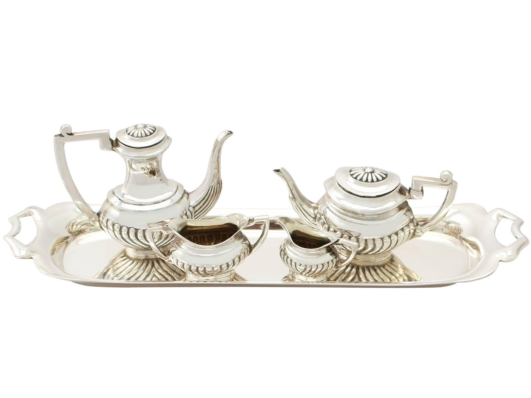 An exceptional, fine and impressive vintage Elizabeth II English sterling silver miniature Queen Anne style four piece tea & coffee service with a matching tray - boxed; part of our silverware collection

The exceptional vintage Elizabeth II