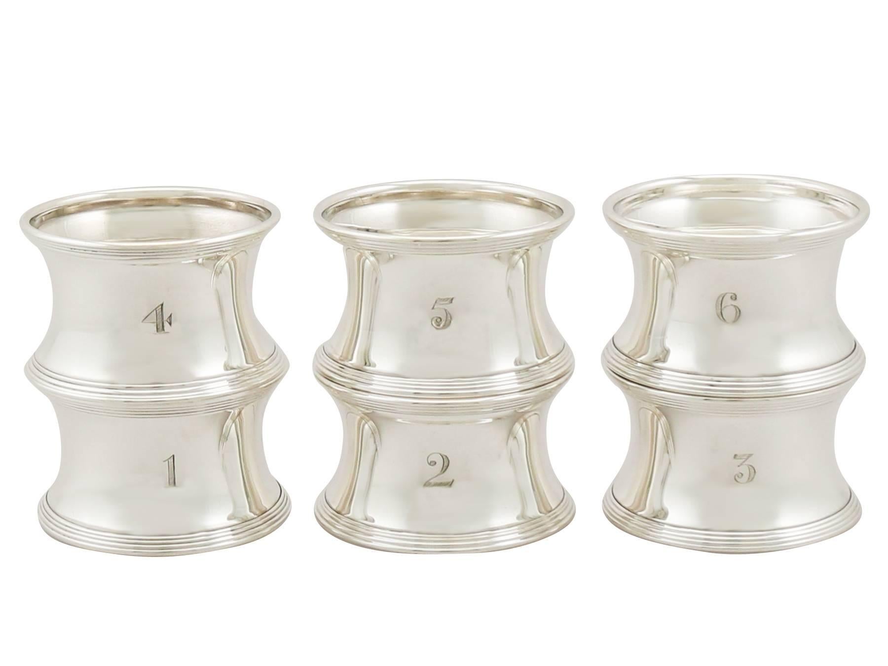A fine and impressive set of six individually numbered antique George V English sterling silver napkin rings, boxed; part of our silver dining collection.

These fine set of antique numbered napkin rings consists of six napkin rings, each with a