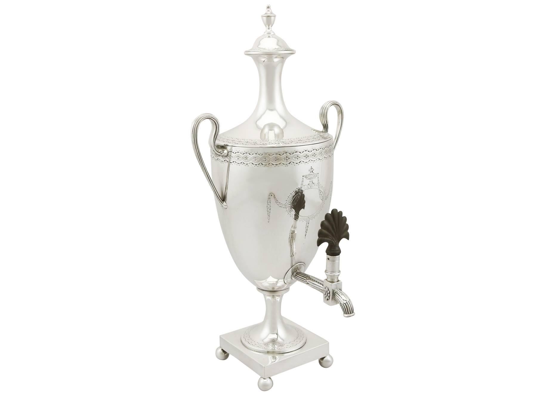 An exceptional, fine and impressive, antique George III English sterling silver samovar; an addition to our Georgian silver teaware collection.

This exceptional antique George III sterling silver samovar has a plain urn shaped form supported by a
