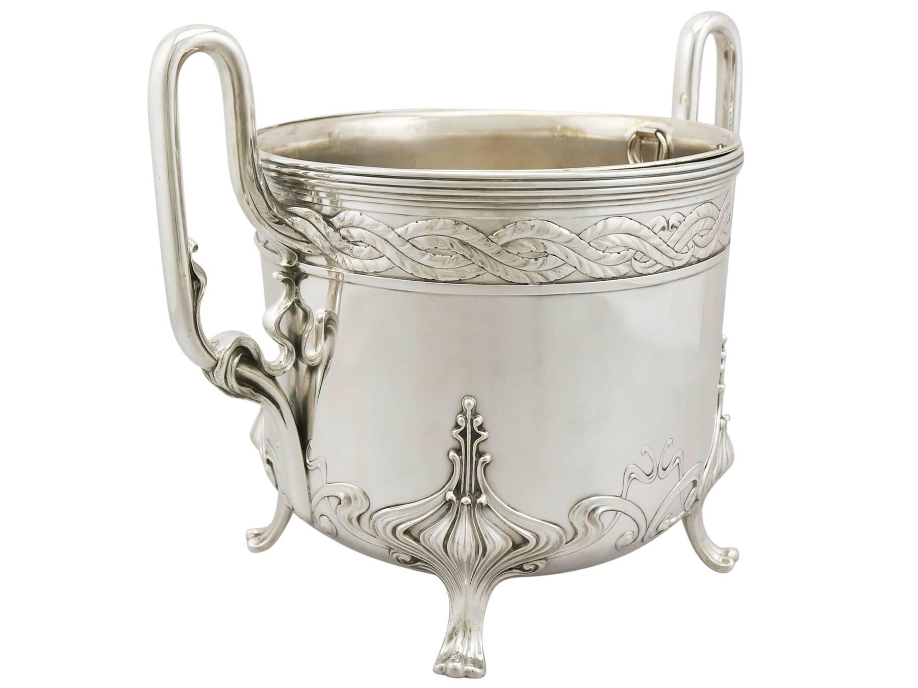 An exceptional, fine and impressive antique German 800 standard silver wine/champagne cooler in the Art Nouveau style; an addition to our presentation silverware collection.

This exceptional antique German silver wine cooler has a circular