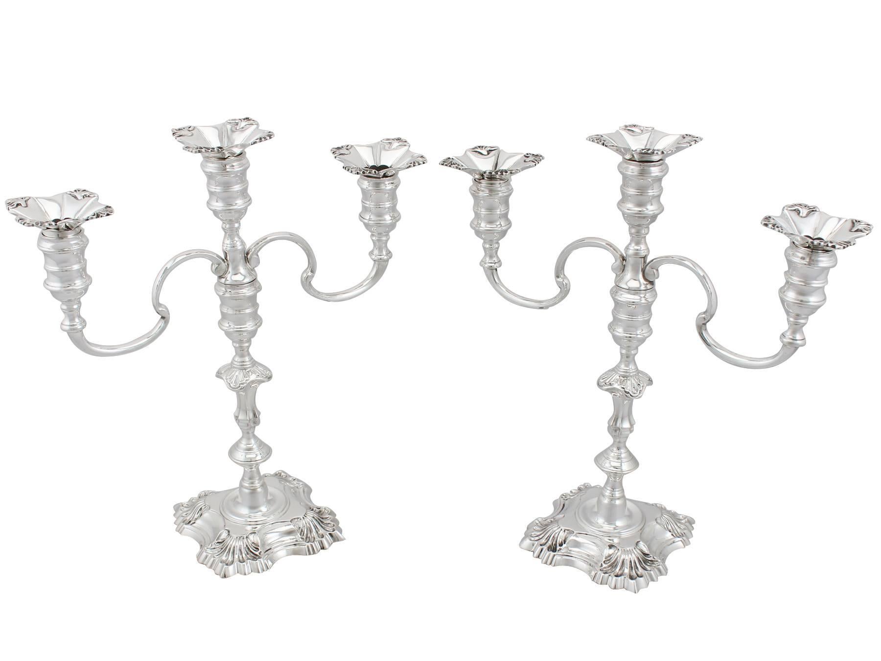 An exceptional, fine and impressive pair of vintage English sterling silver three light candelabra; an addition to our ornamental silverware collection.

These exceptional vintage cast sterling silver candelabra been crafted in the classic four