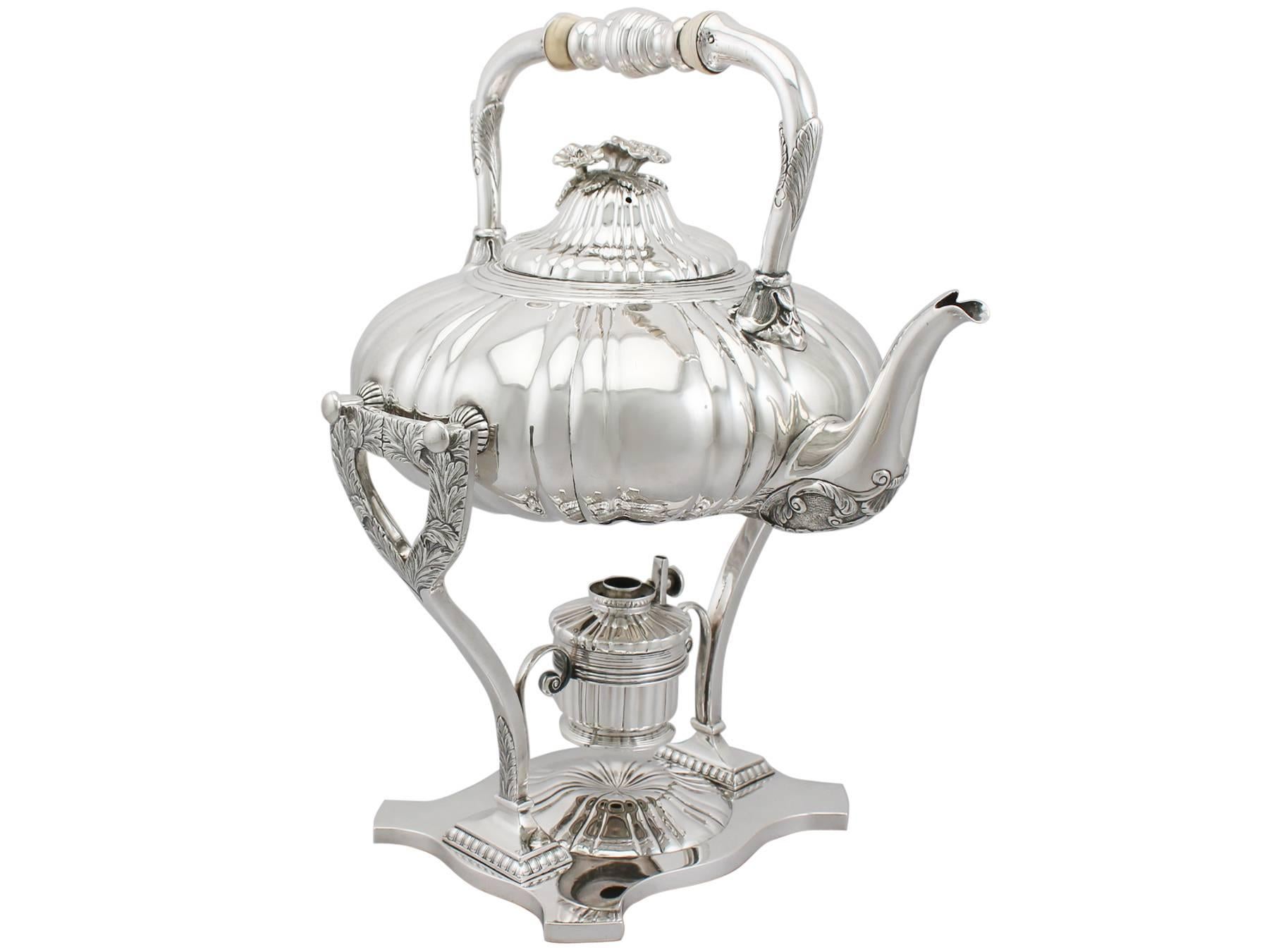 An exceptional, fine and impressive antique German silver spirit kettle; an addition to our antique silver teaware collection.

This exceptional antique German standard silver spirit kettle has a circular compressed melon shaped form.

The surface