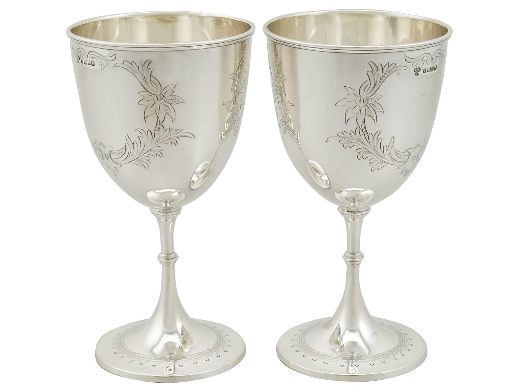 An exceptional, fine and impressive pair of antique Victorian English sterling silver goblets; an addition to our range of wine and drink related silverware.

These fine antique Victorian sterling silver drinking goblets have a plain circular bell