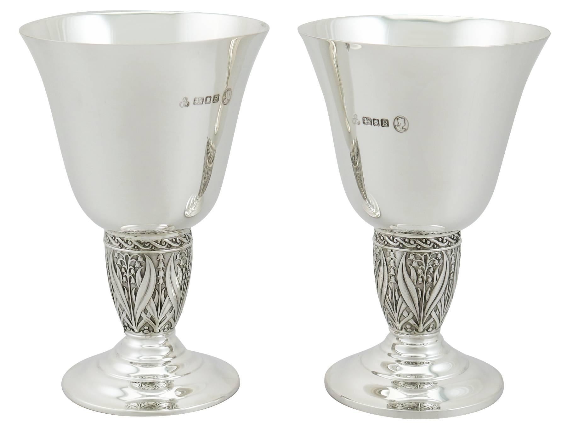 An exceptional, fine and impressive pair of vintage English sterling silver goblets; an addition to our range of wine and drink related silverware.

These exceptional vintage sterling silver goblets have a plain circular bell shaped form circular