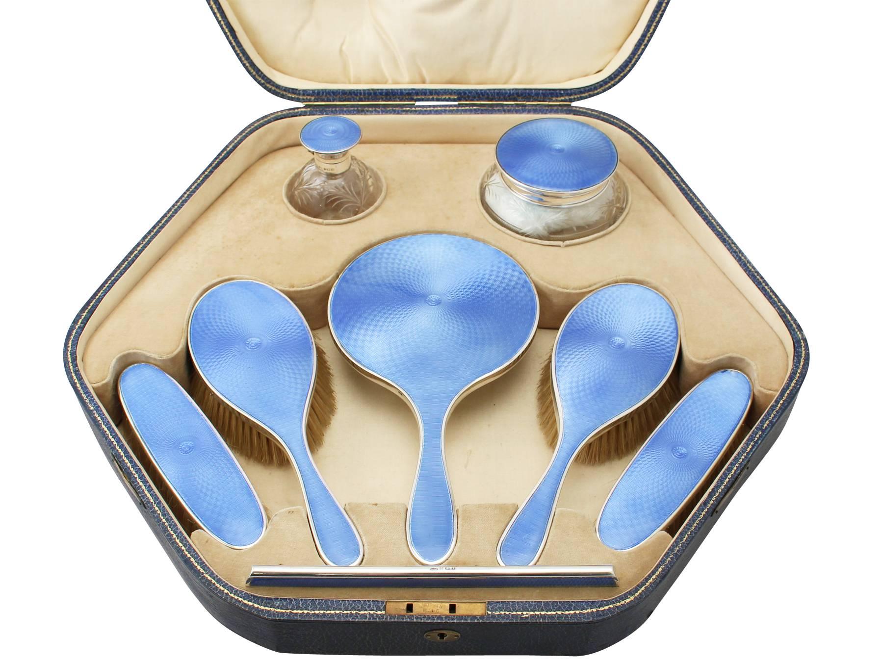 A fine, impressive and comprehensive antique George V English cut glass, sterling silver and guilloche enamel eight piece dressing table set - boxed; part of our silverware collection.

This impressive antique George V cut glass, sterling silver and