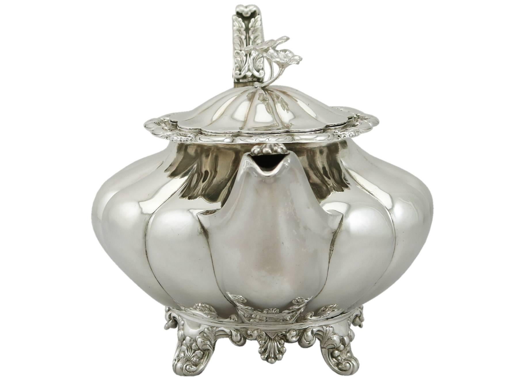 An exceptional, fine and impressive antique Victorian Irish sterling silver teapot; an addition to our silver tea ware collection.

This exceptional antique George IV Irish sterling silver teapot has a compressed melon shaped form.

The large