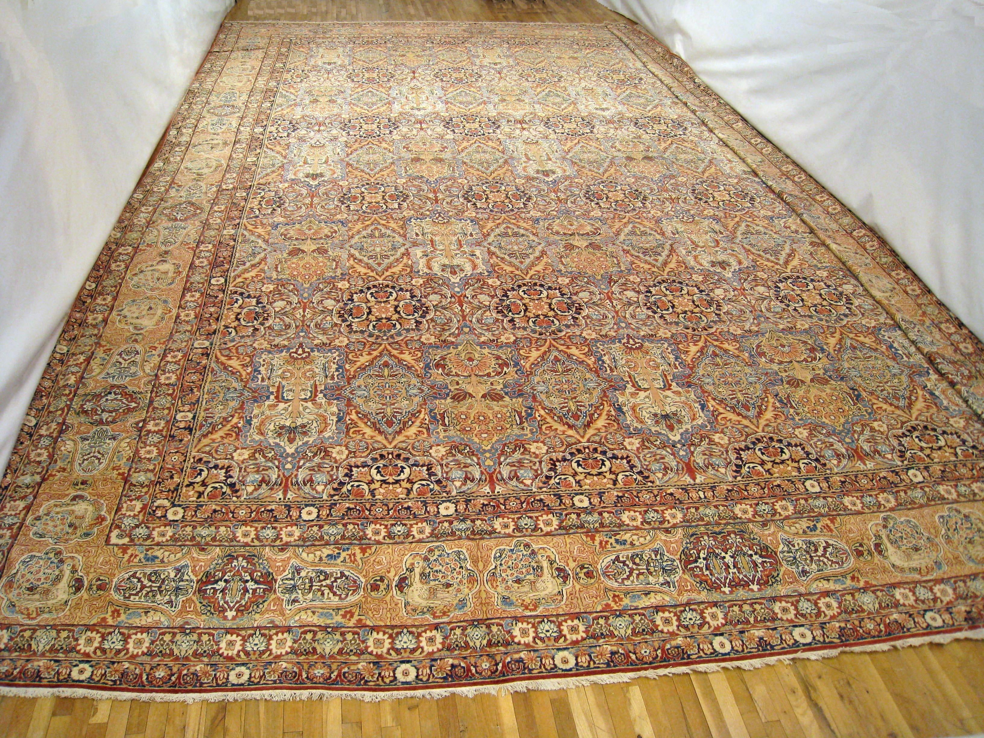 An antique Persian Lavar oriental rug, size 26'8