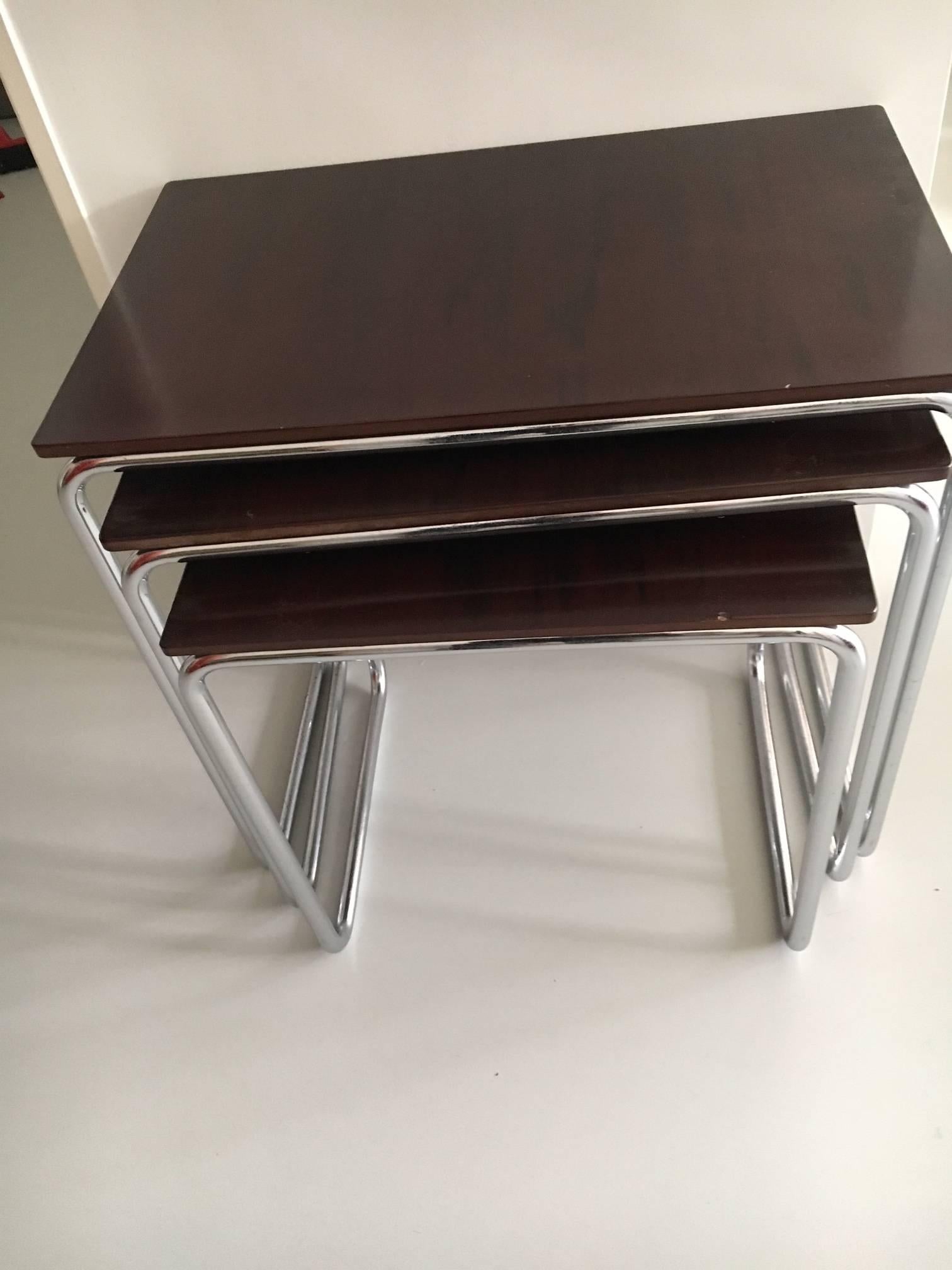 Nest of three side tables of tubular steel with authentic bakelite tops. Produced by Veha, former J.B. van Heyst & Sons in the Hague. The firm was known for the production of their steel windows and doors for functionalist architecture of the 1930s.