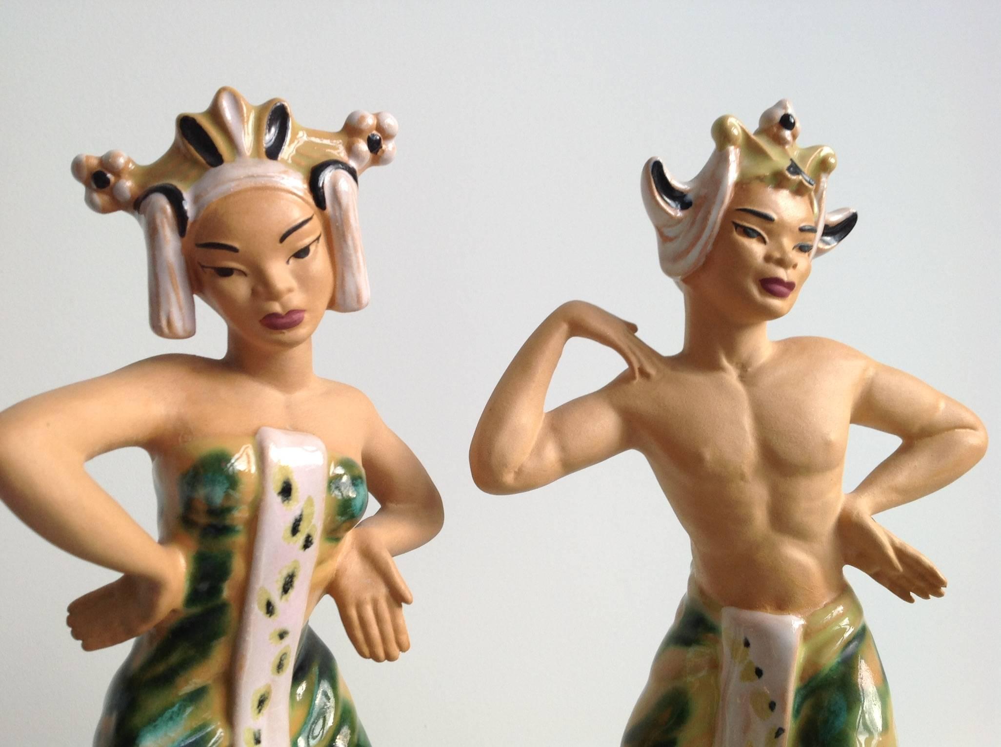A striking Balinese dance couple of polychrome pottery, designed by the American Betty Harrington at
Ceramic Arts Studio of Madison(CAS). Since the 1930s the island of Bali in Indonesia was discovered as
the last paradise on earth, because the
