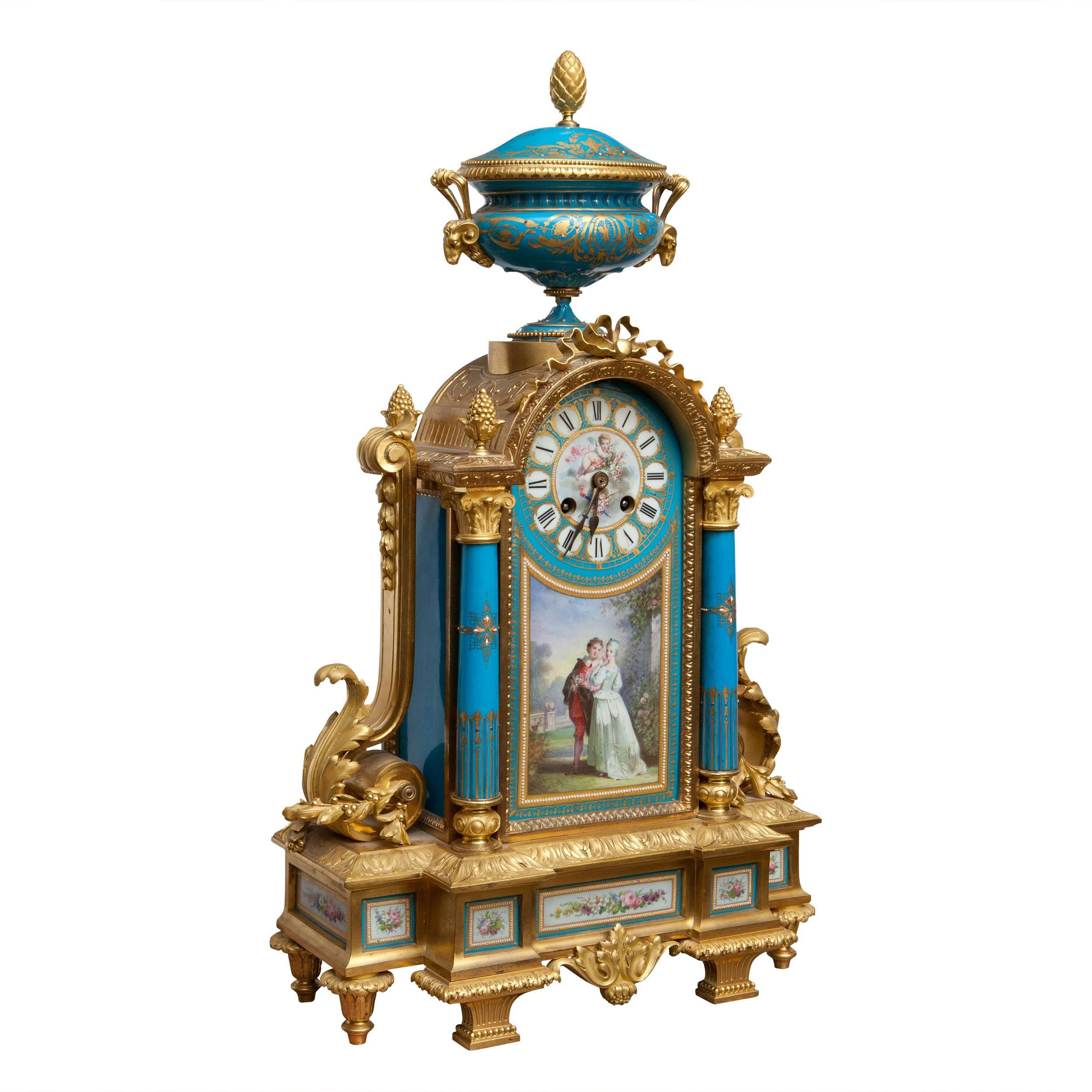 France, circa 1870.

A fine late 19th century ormolu and porcelain mounted mantel clock, the painted dial above a courting couple scene, the whole mounted with a Krater vase and raised on a stepped porcelain mounted base. 

The clock is 54cm