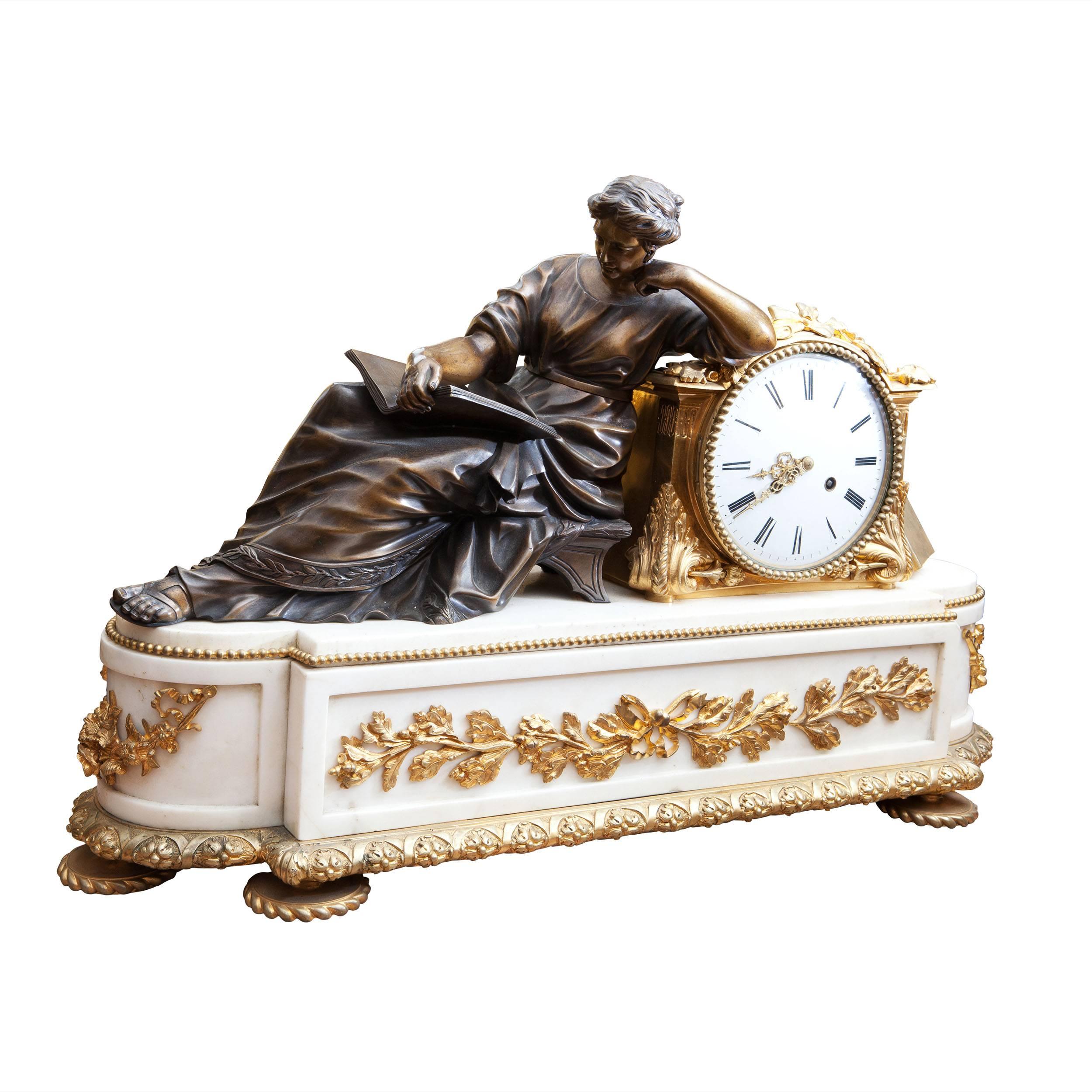 France, circa 1860-1880.

A fine late 19th century large white marble and ormolu mantel clock with a finely cast and patinated bronze lady reading.

The clock is in superb condition and has been restored by a specialist in French clocks.