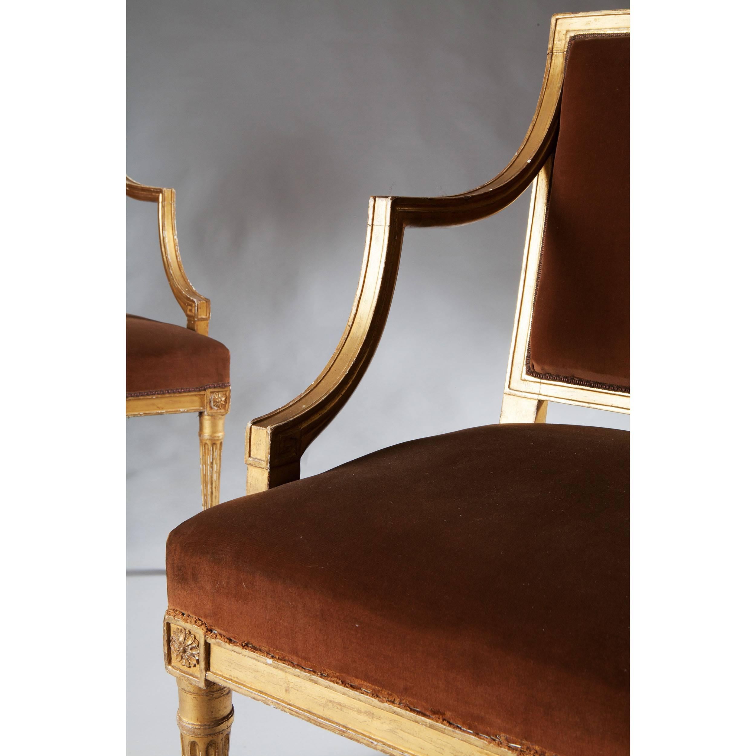 England, circa 1780.
​
A fine pair of late 18th century neoclassical giltwood armchairs, the gadrooned frames with open arms and raised on tapering fluted legs.

Please see photographs for condition. 
Measures:
Height 36 1/2 inches