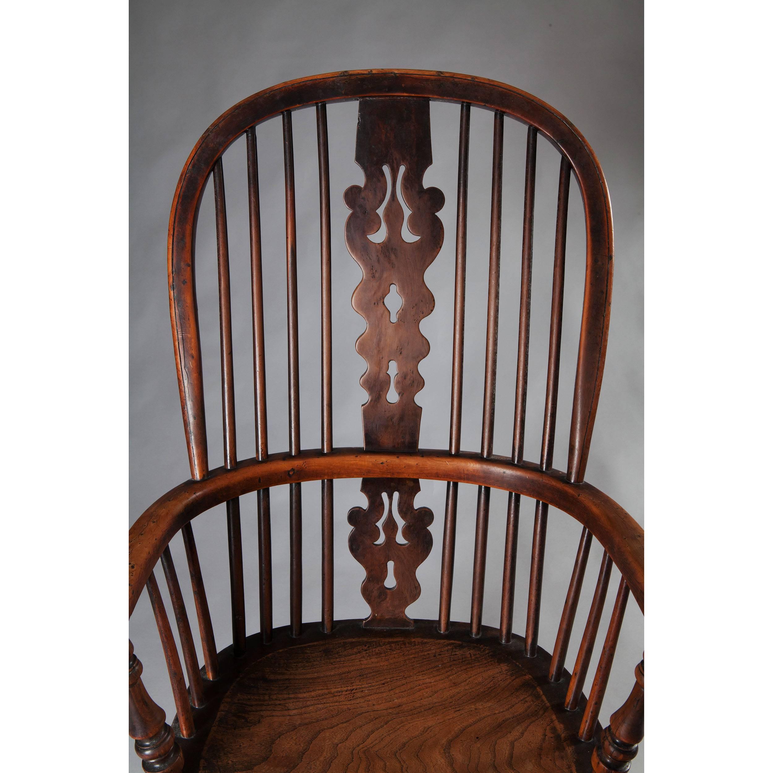 Early 19th century yew wood windsor armchair with crinoline stretcher, well figured.

Height: 105cm.
Width: 55cm.
Depth: 45cm.
​Seat height: 42cm.

The windsor chair is established as one of the great classics of English country furniture.