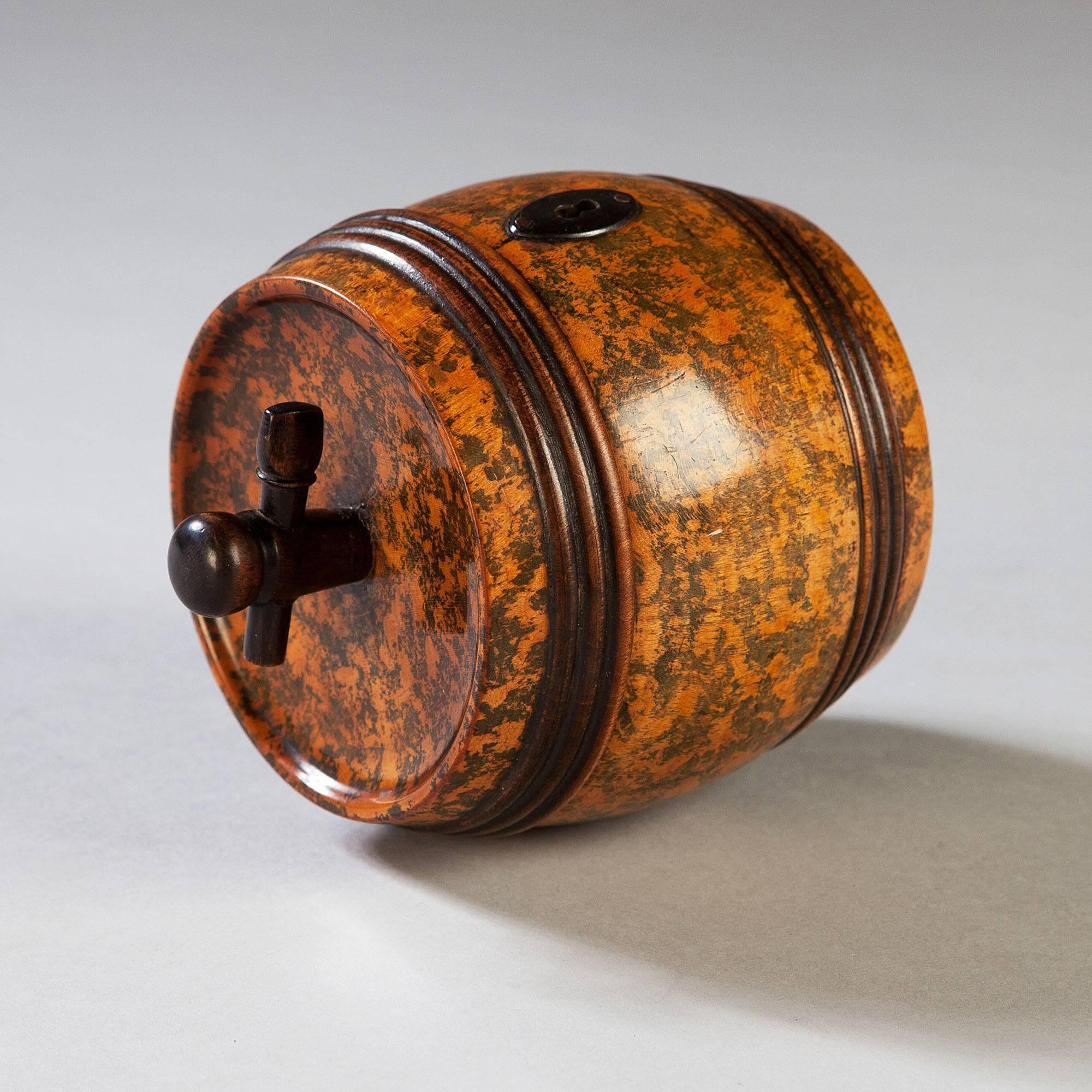 England, Early 19th century.

An exceptional and very rare early 19th-century tea caddy in the form of a barrel. The surface retaining its vivid green staining and fine patina, the lid opening to the interior retaining remains of the original foil