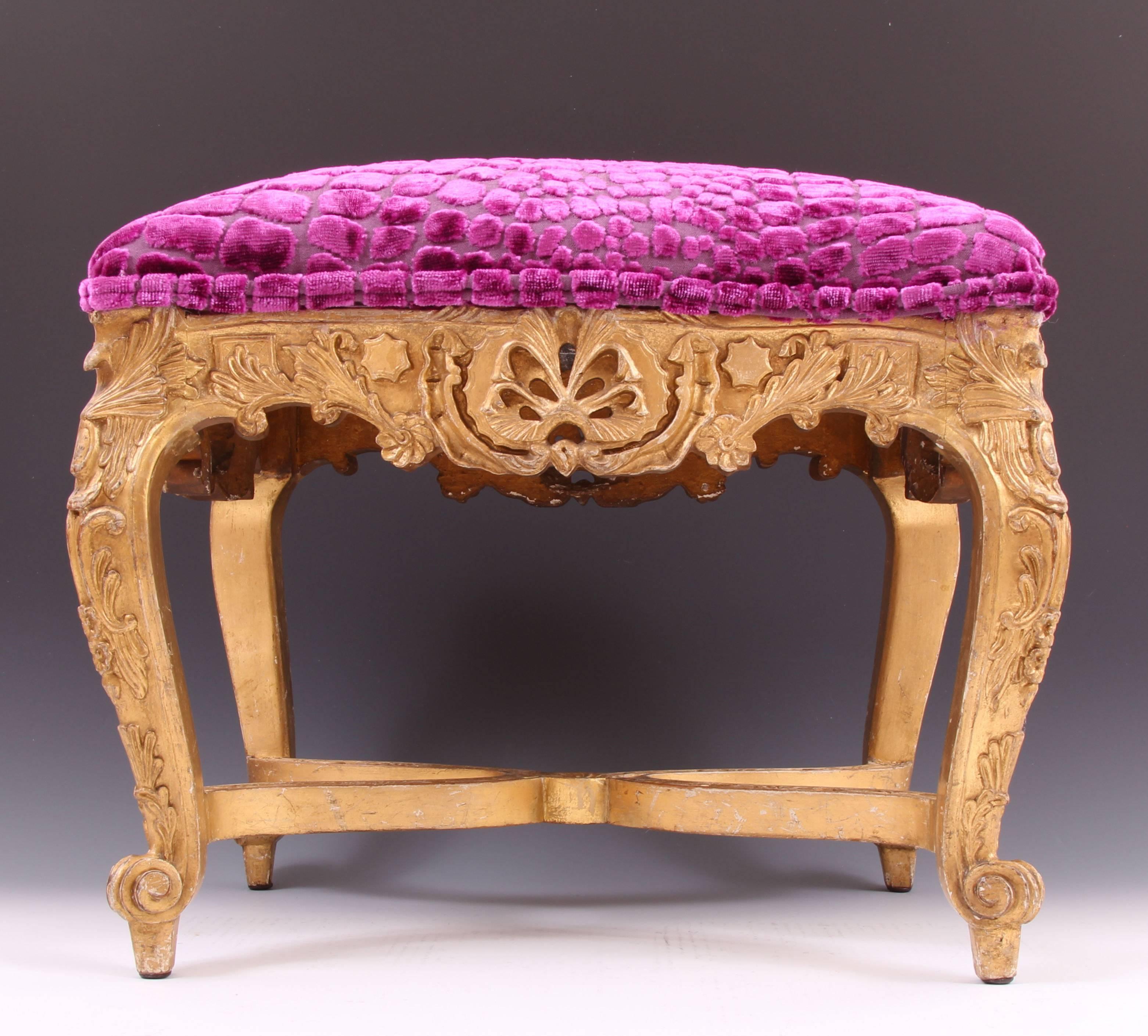 Important and rare early Louis XV giltwood serpentine tabouret, circa 1735. The carving, attention to detail & palatial quality of this splendid piece is absolutely superb. Covered in the finest fabric, patterned with a beautiful Royal fuchsia /