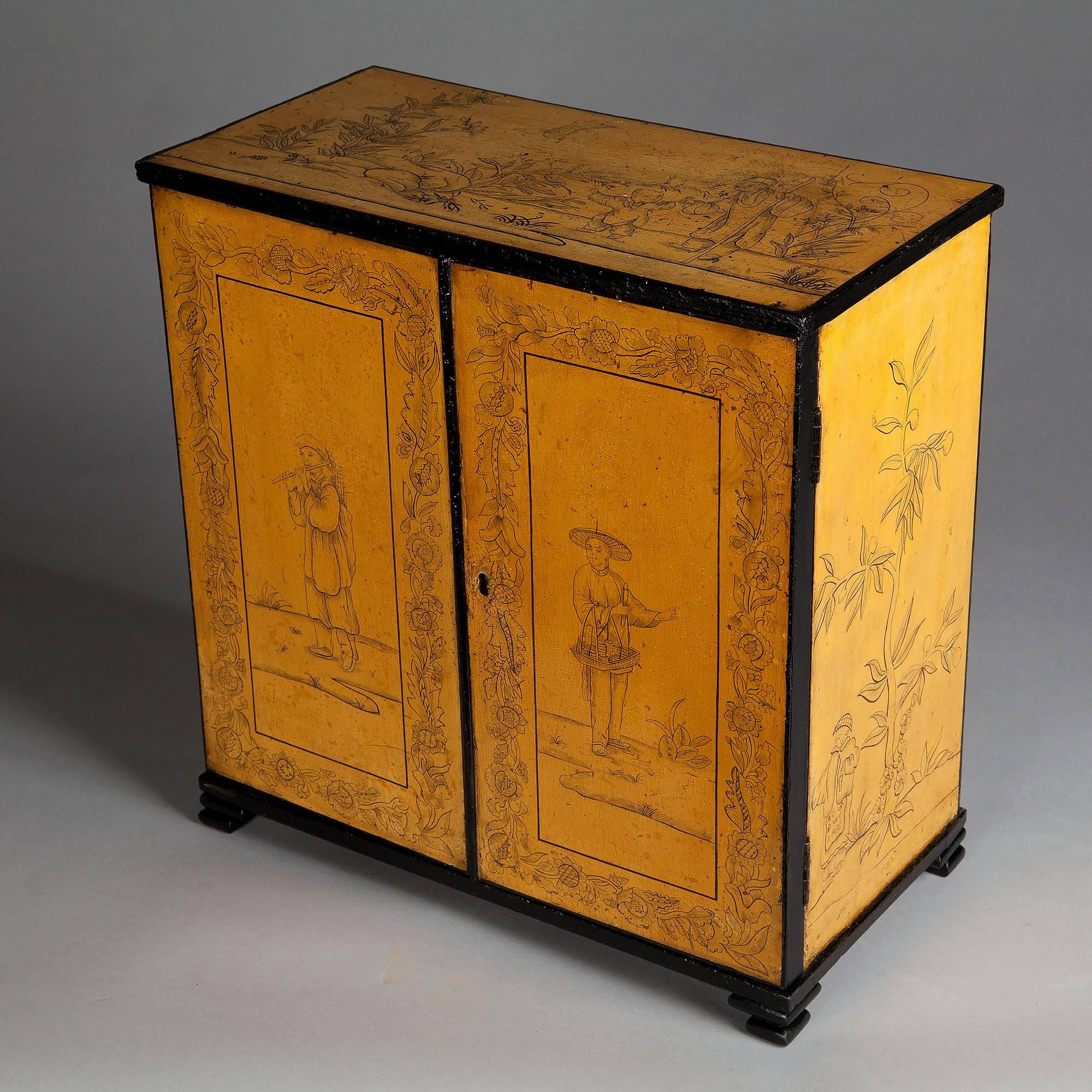 A fine early 19th century yellow lacquer cabinet decorated on all sides with penwork chinoiseries, the double doors opening to a fitted interior with four pigeon holes and four drawers, each with a silver drop handle and backplate.

Measures: