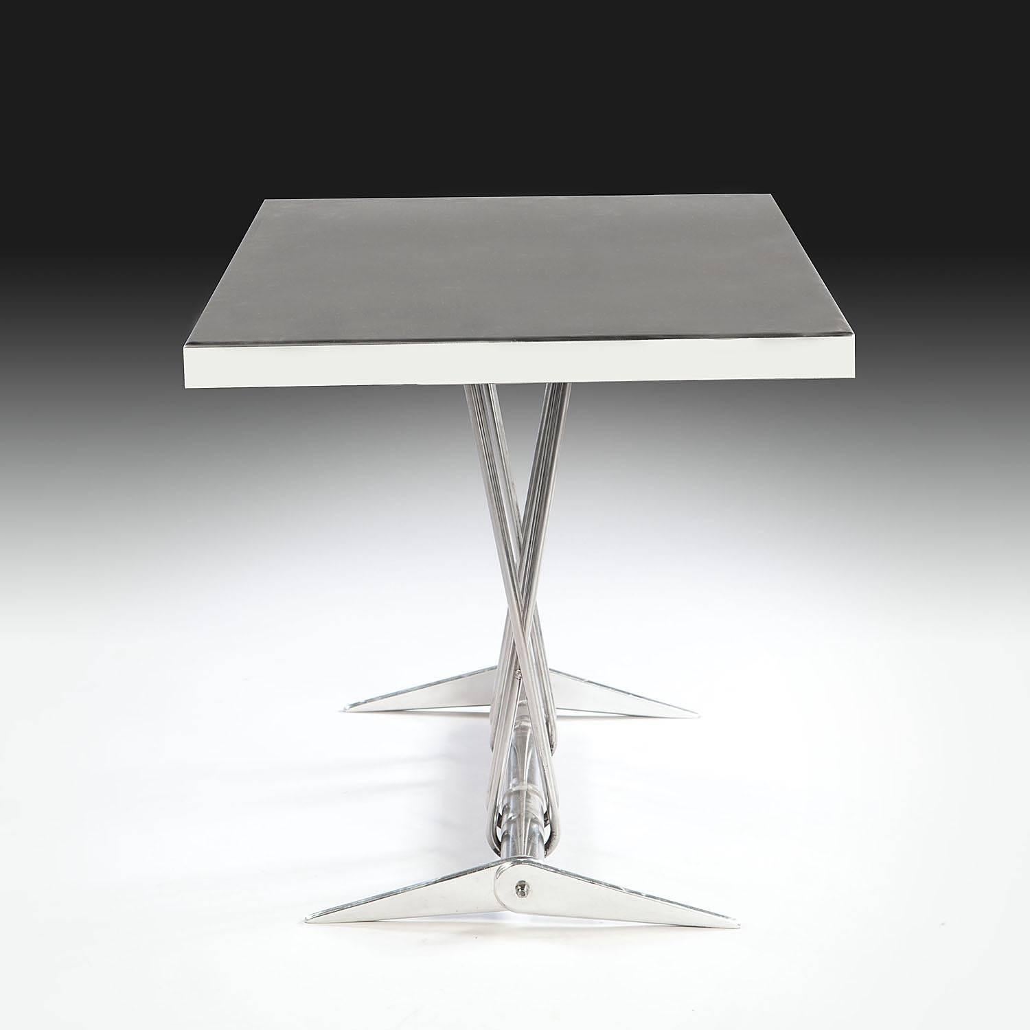 France, circa 1950.

A polished steel rectangular center table on column supports with splayed bracket feet. In the manner of Jean Prouvé.

Measures: Height 30 ins (76 cm).
Width 41 ins (114 cm).
Depth 23 ins (58 cm).
