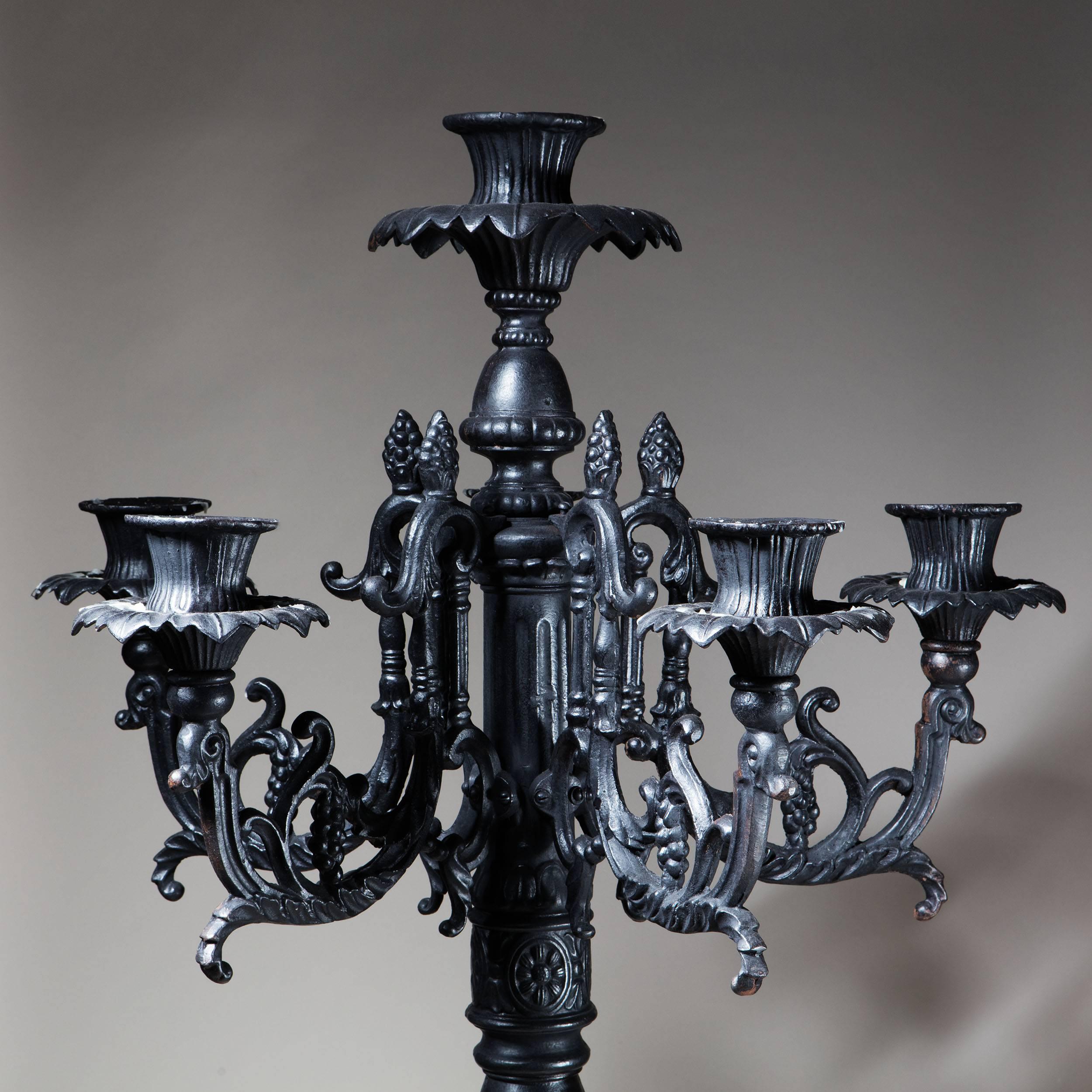 A fabulous large-scale 70 inch freestanding floor candelabrum of substantial scale. With six scroll arms around a central raised candle holder, the Baroque baluster stem with tripod legs and terminating in Rococo scroll feet. 

 