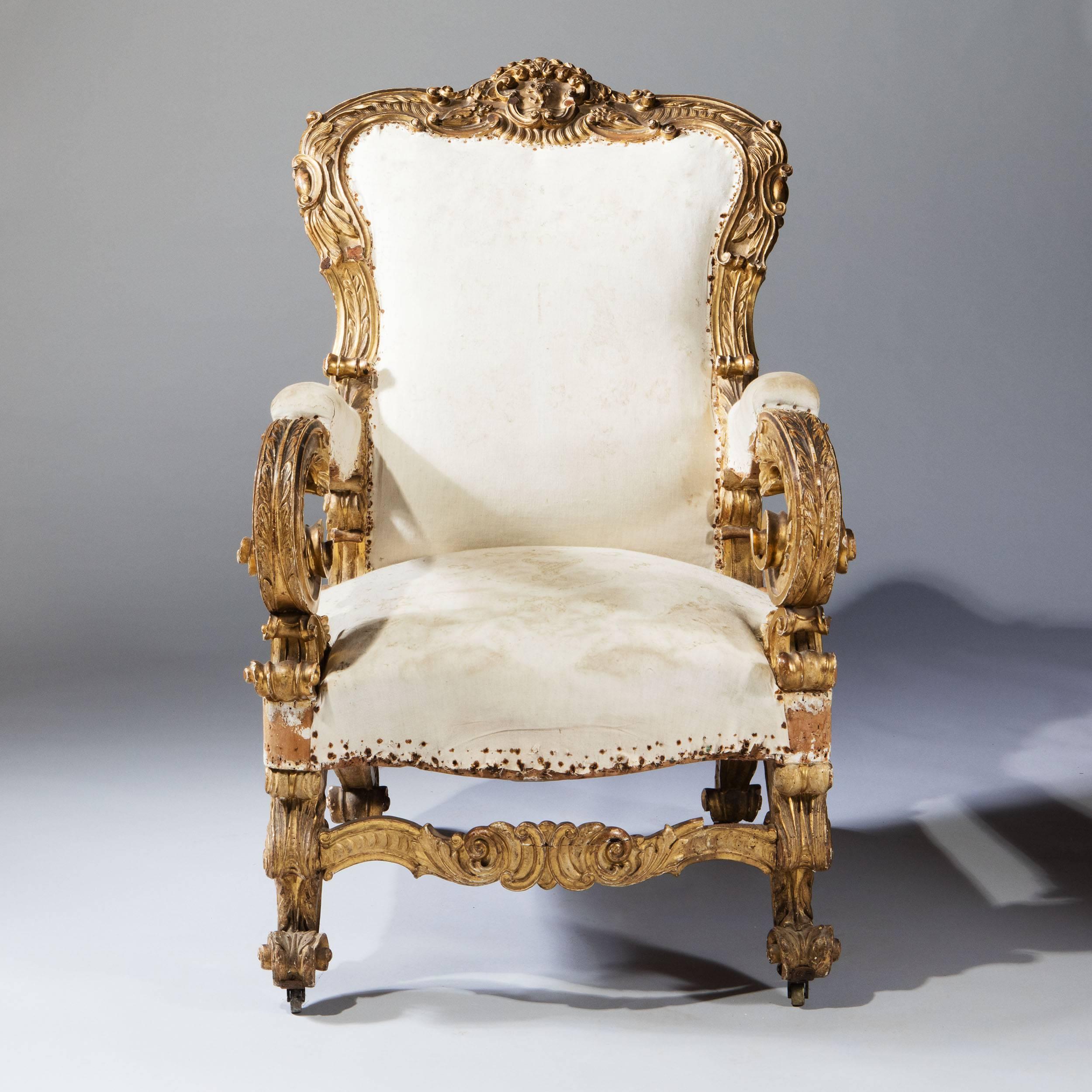 Northern Italy, circa 1780

A substantial North Italian 18th century giltwood Throne Chair in original condition. The overscale frame richly carved with neoclassical and exaggerated Baroque ornament, substantial scrolled arms and legs, the front