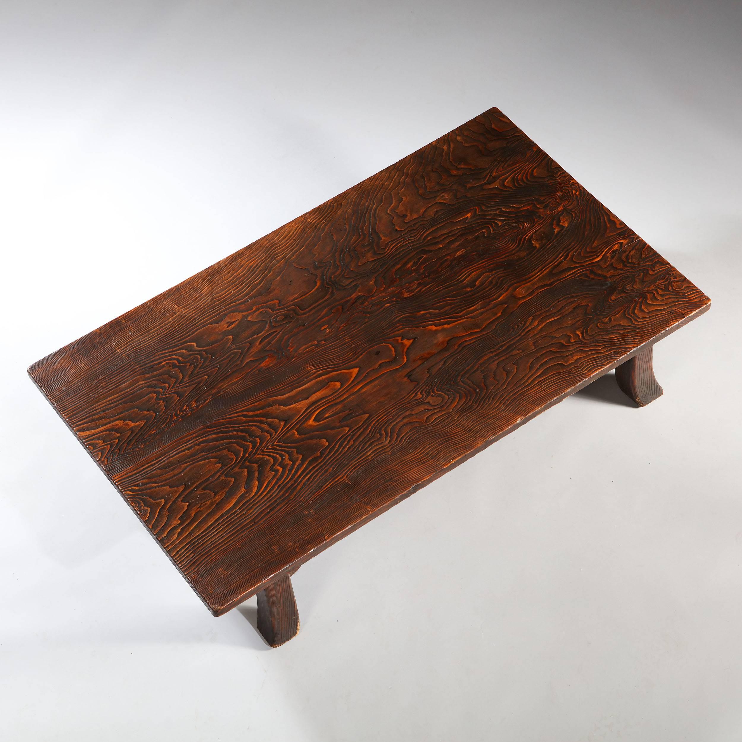 A very fine 19th century antique Japanese low table -  A traditional Japanese low table constructed from a incredible substantial cedar plank and raised on elegant out swept legs.

Japan, circa 1900

Measures: Height 30cm
Width 152cm
Depth