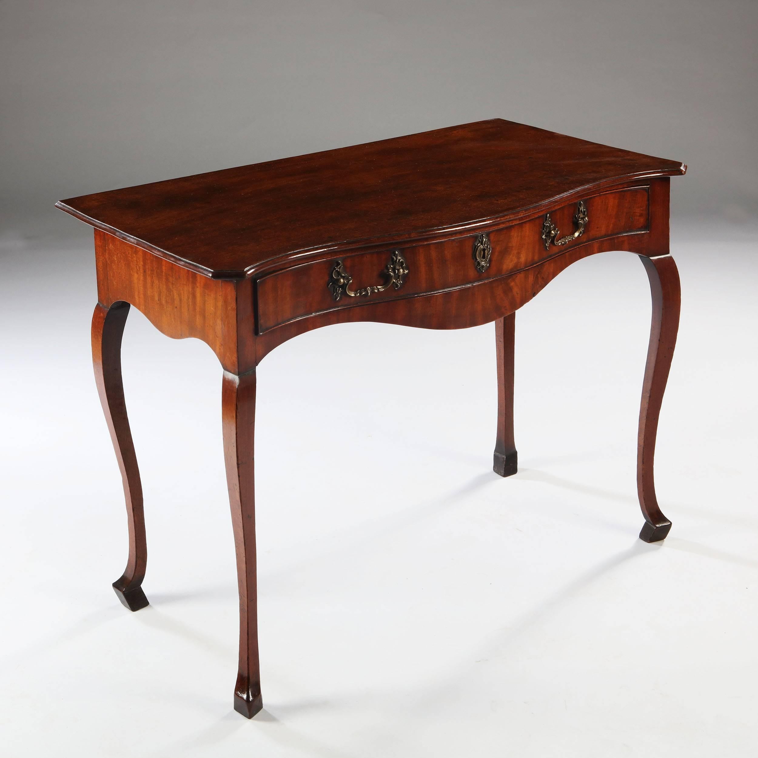 Very elegant serpentine fronted George III Chippendale side table.

England, circa 1780

Measures: Height 71cm (28in)
Width 90cm (35 1/2in)
Depth 50cm (19 3/4in)

A very elegant serpentine fronted mahogany George III Chippendale side table ,