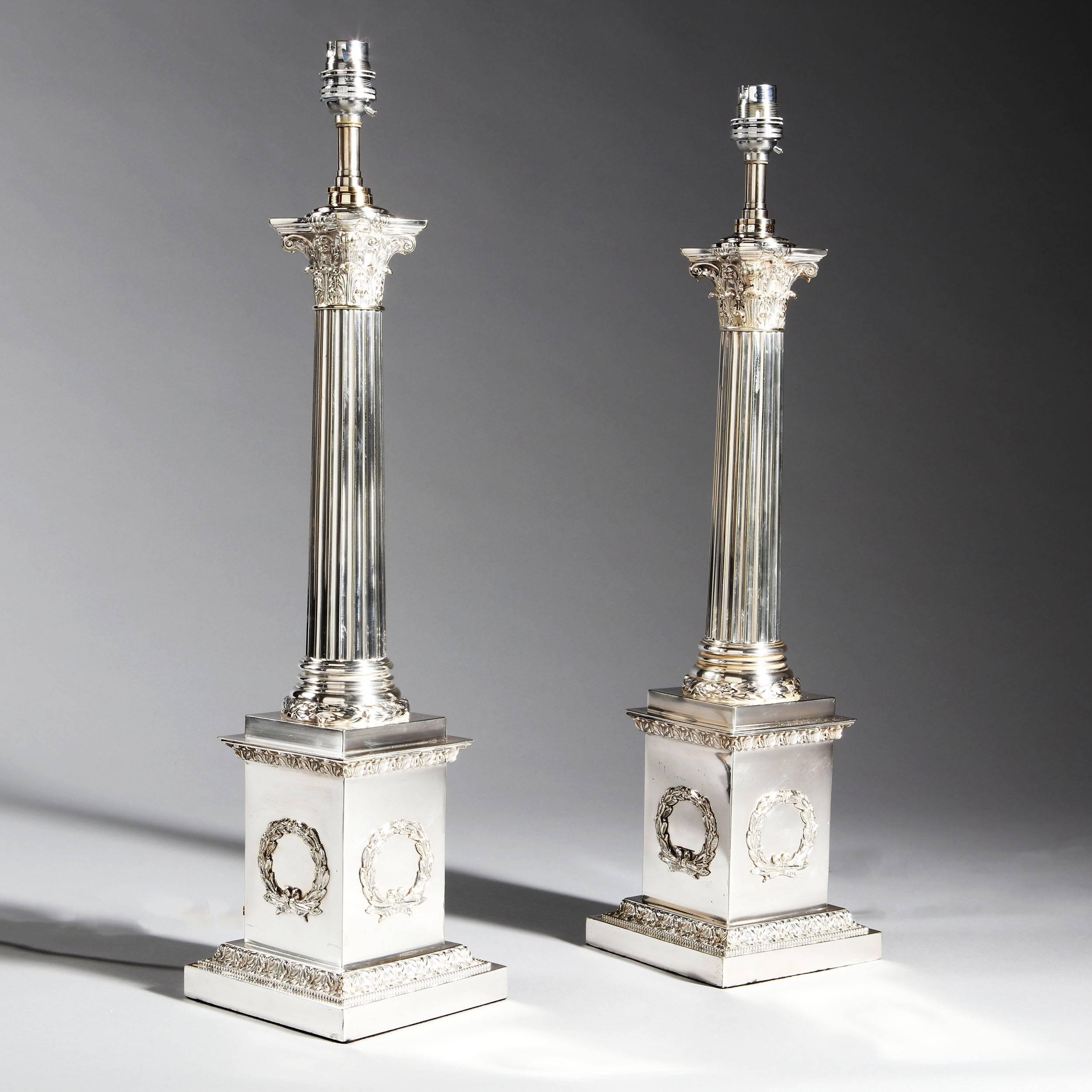 Pair of turn of the century silver plate Corinthian column lamps of exceptional quality. Retaining their original surface, these lamps have been hardly touched in 100 years. They are in perfect original condition, just rewired for modern