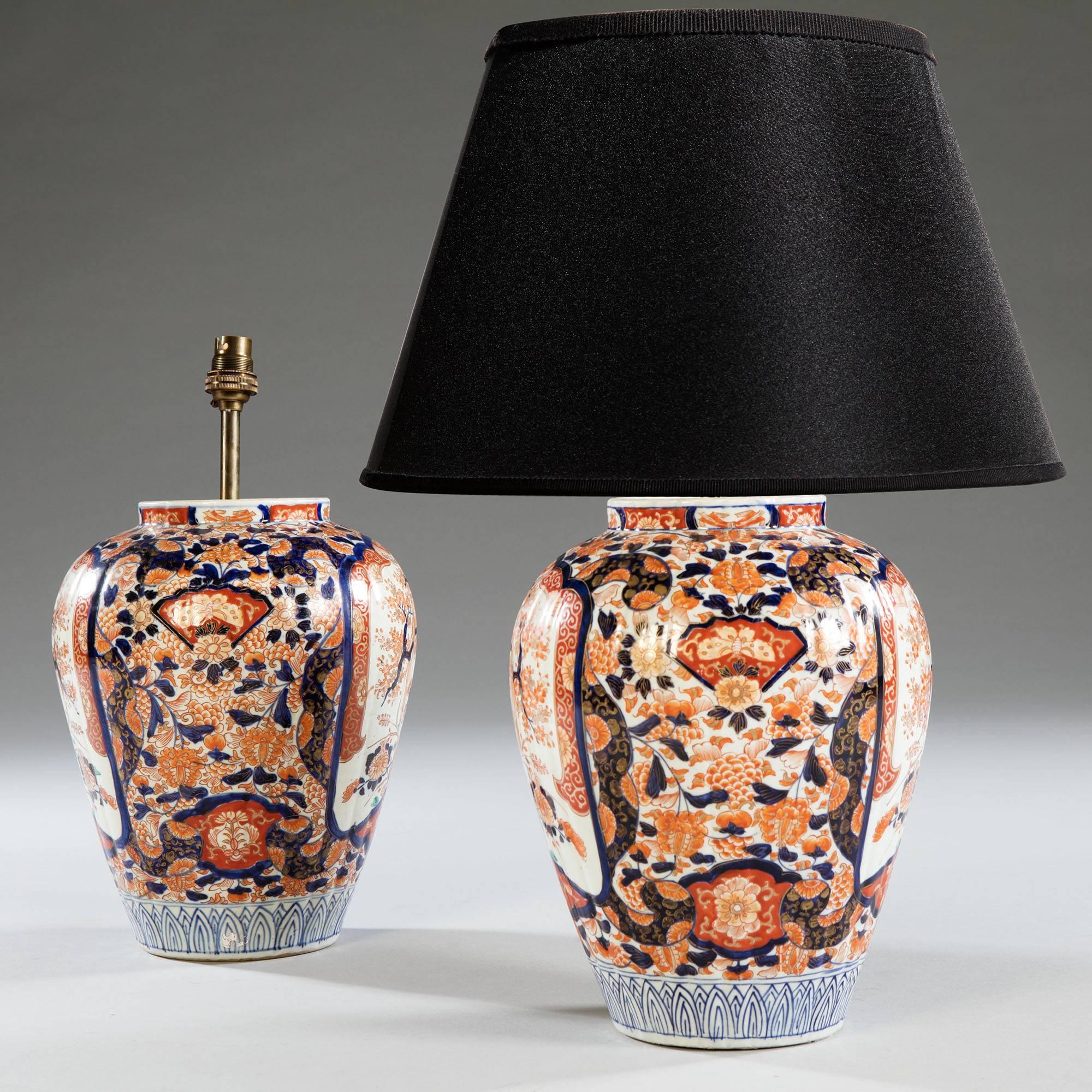 A well-scaled pair of 19th century Japanese Imari temple jars, the baluster shape bodies with raised fluting and rich decoration with highlights in gold.
Shade available separately 

Measures: Height to the top of the vase 33 cm, 13 in.
Diameter