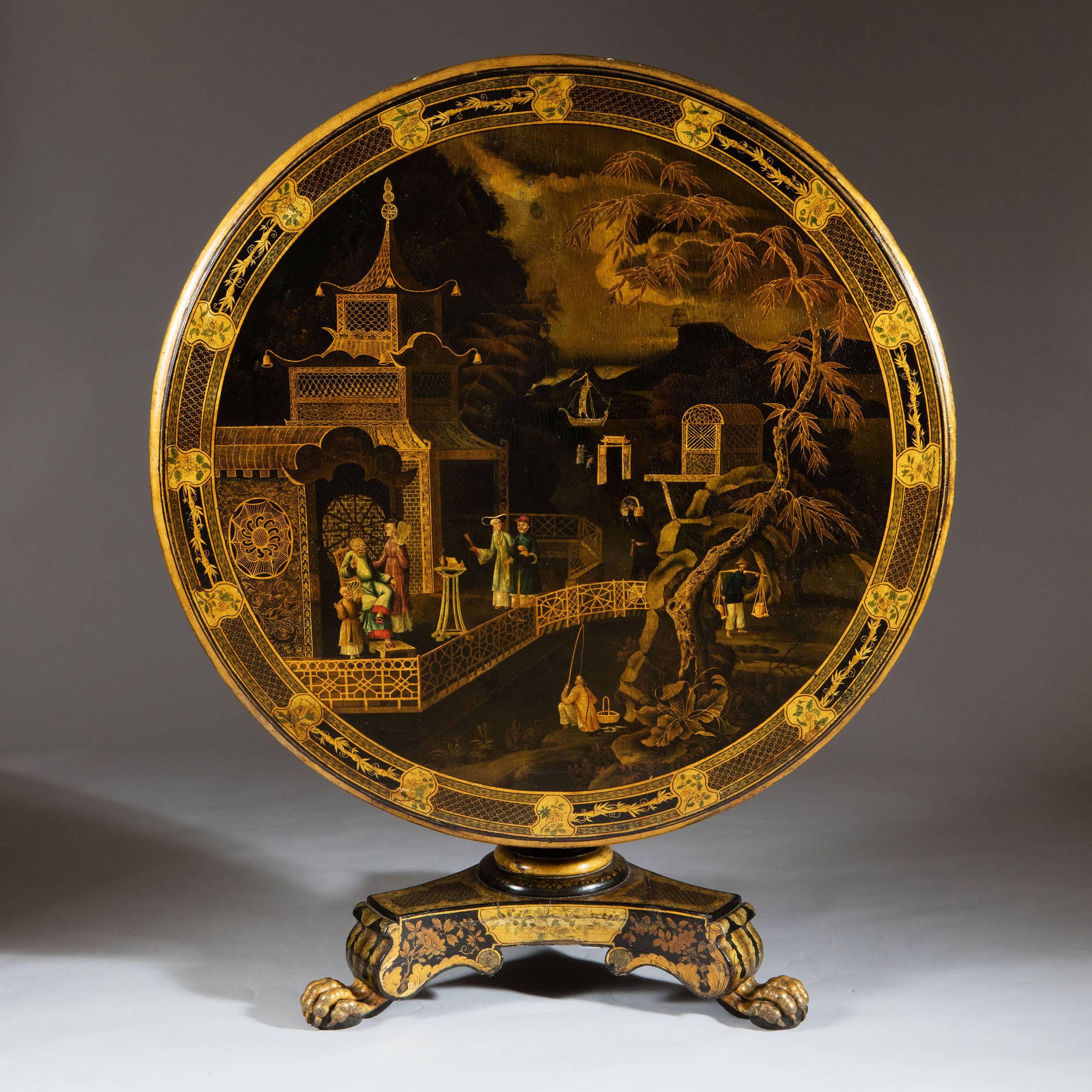 An exceptional and very rare early 19th century Regency period Chinese export lacquer center table decorated though out with scenes of daily life amongst pagoda's rivers and landscape. The circular top raised on a turned base with triform base and
