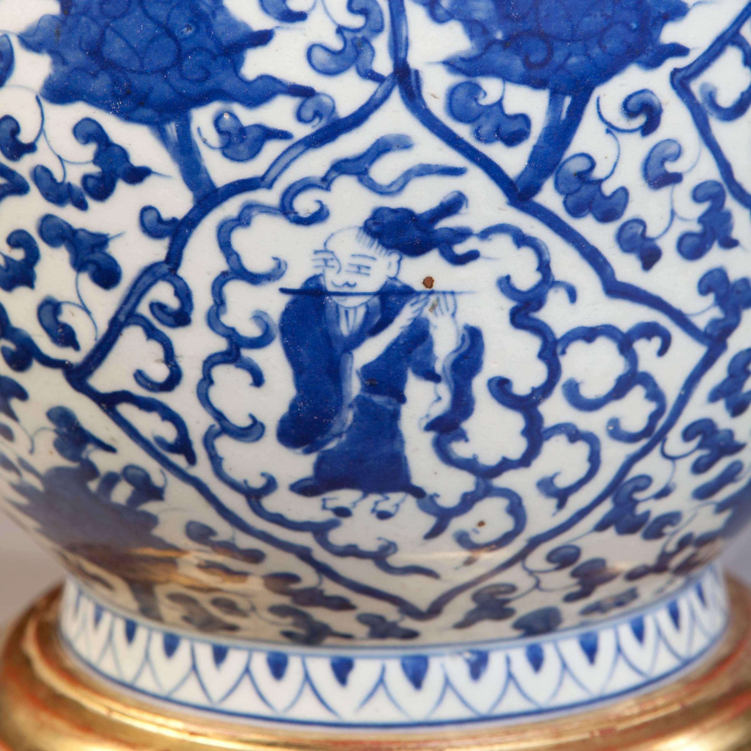 A wonderfully decorative 19th-century Chinese blue and white porcelain vase, made for the European export market, the form known as 'Hu' decorated with figures of philosophers. 

The decoration is rich and varied, without being overly fussy, the