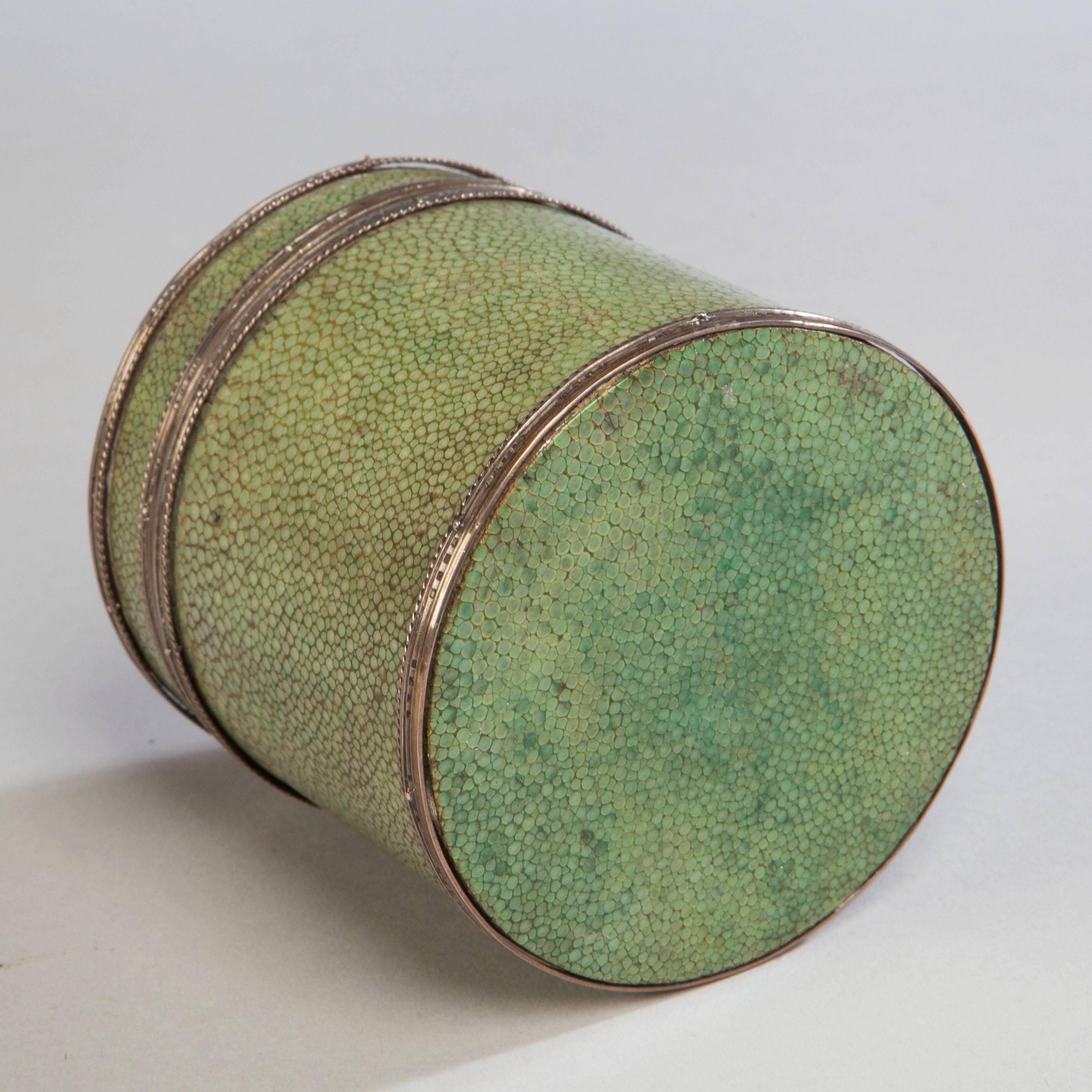A fine circular wooden box with domed lid, wrapped throughout with shagreen and mounted with silver. The inside lid retaining the J Paul Cooper stamp.

Literature: John Paul Cooper (3 October 1861 – 3 May 1933) was an architect and a leading