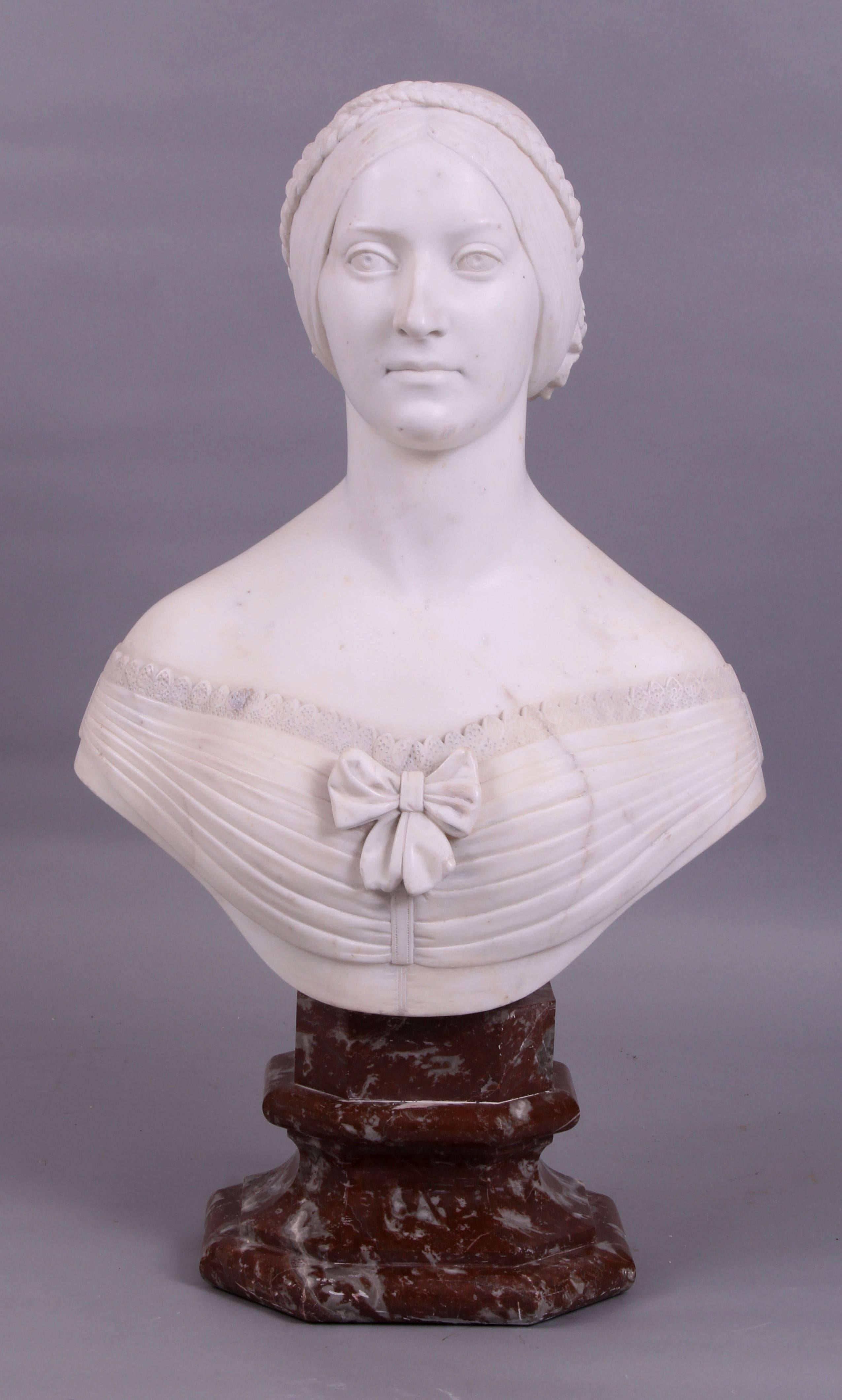 Superb and impressively grand sized 19th century carved statuary white marble bust of a noble lady raised on a truly beautifully shaped rouge marble stepped socle. 

Although unsigned, the exquisitely carved face, detail of flowers in the hair,