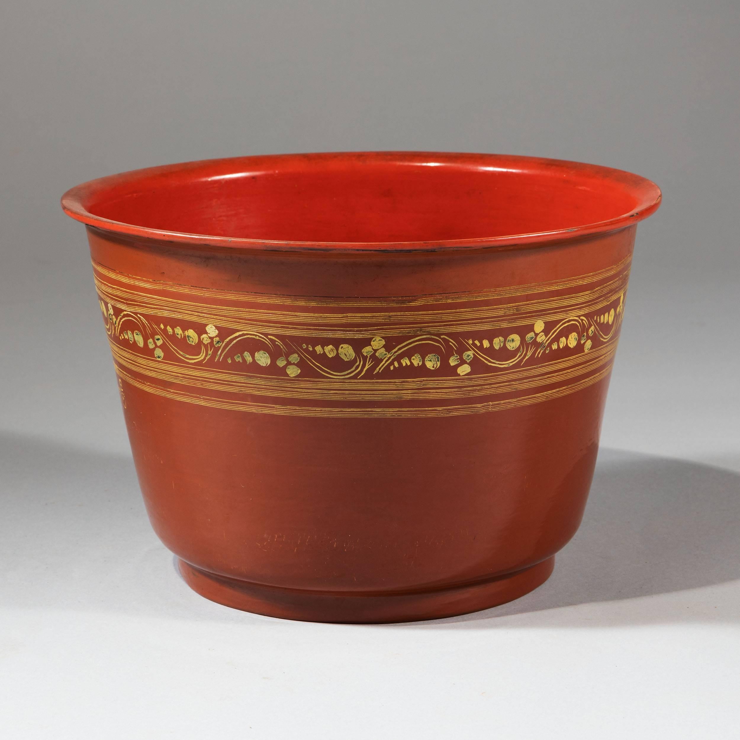 Burmese, late 20th century.

A collection of ten Burmese lacquer bowls, each with terracotta coloured interiors and darker brown exteriors with gilt detailing. 

Measures: Height 21 cm.
​Diameter 30 cm.