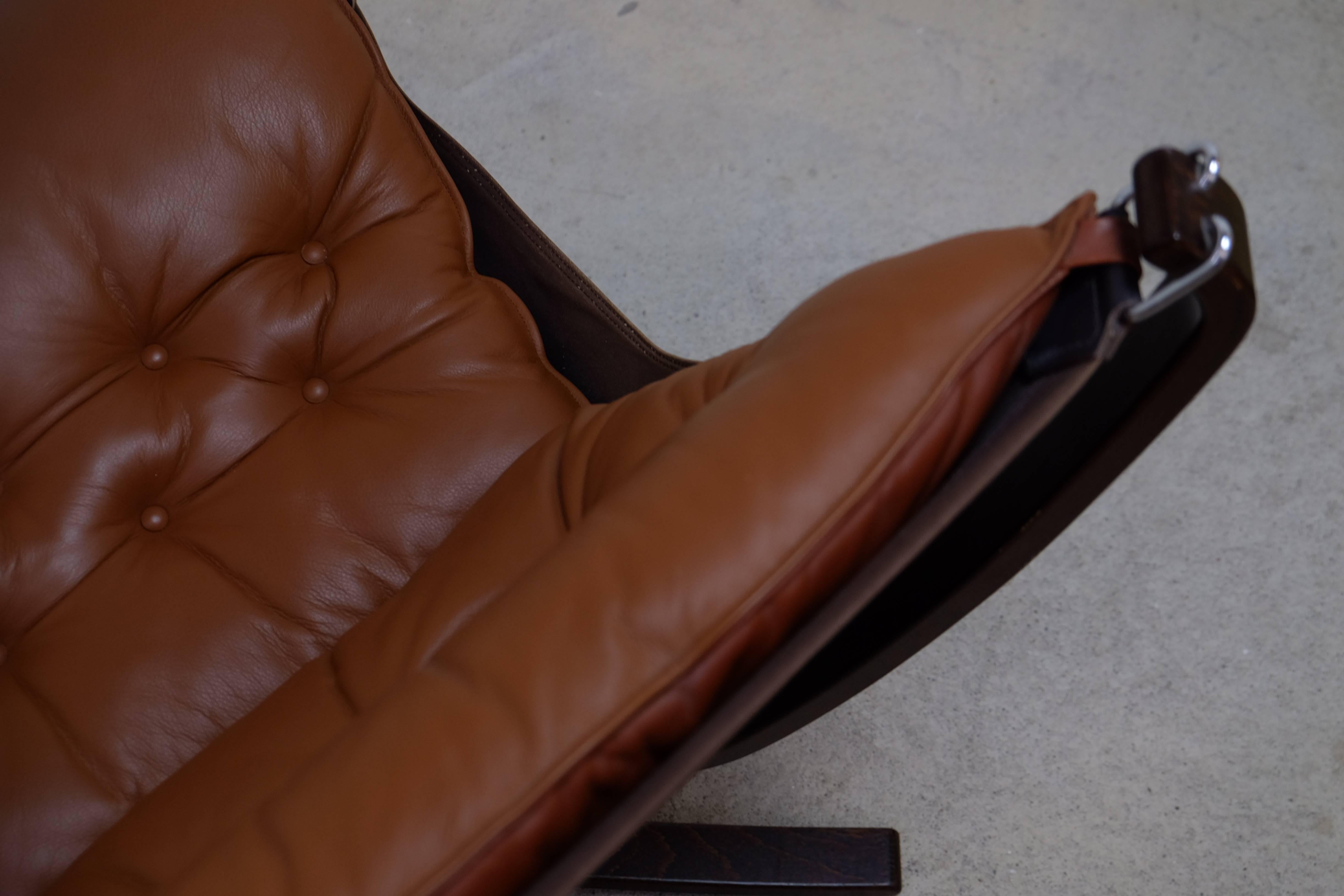 Norwegian Falcon chair in perfect chocolate brown leather by Sigurd Ressel, 1971. Mint condition.