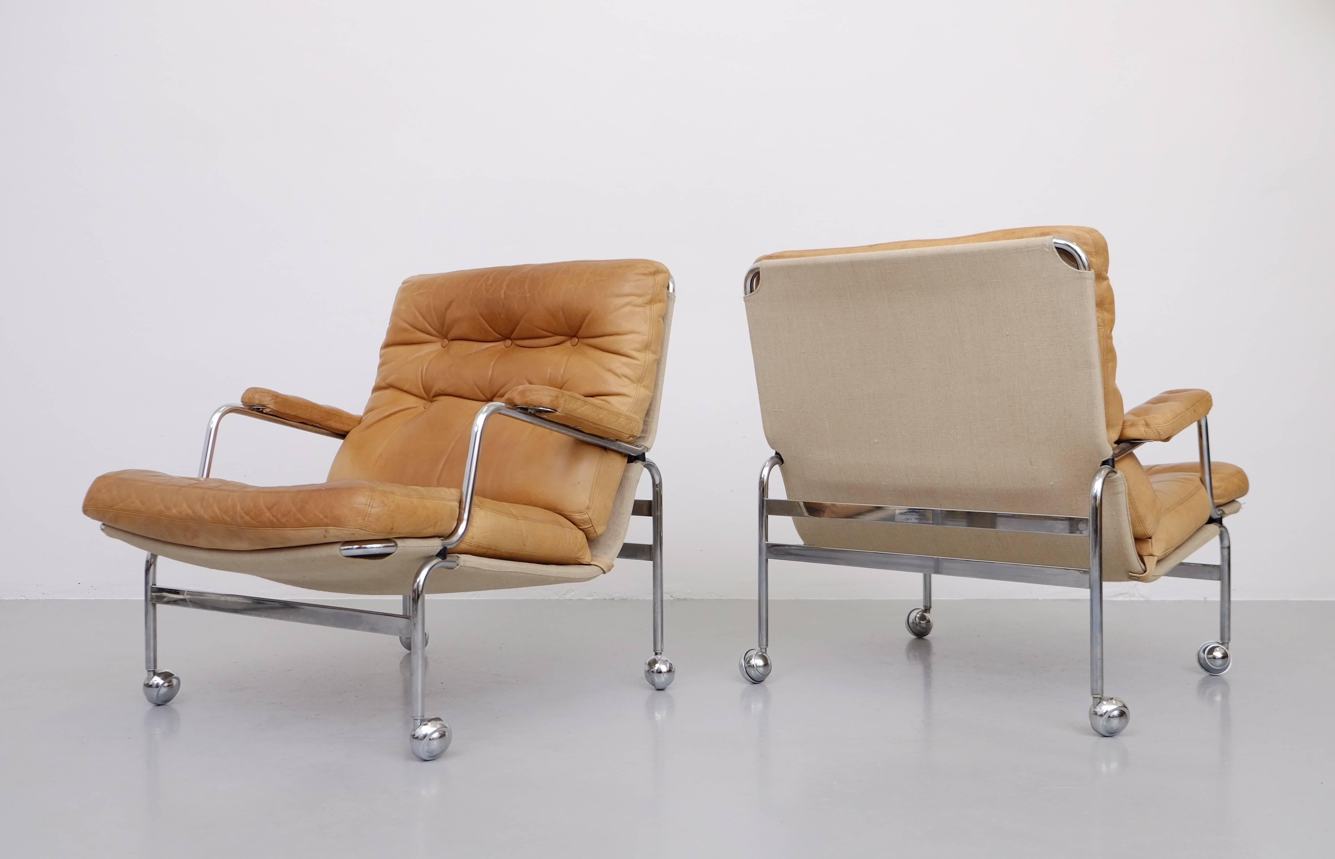 Pair of easy chairs model Karin by Bruno Mathsson. In original natural leather.