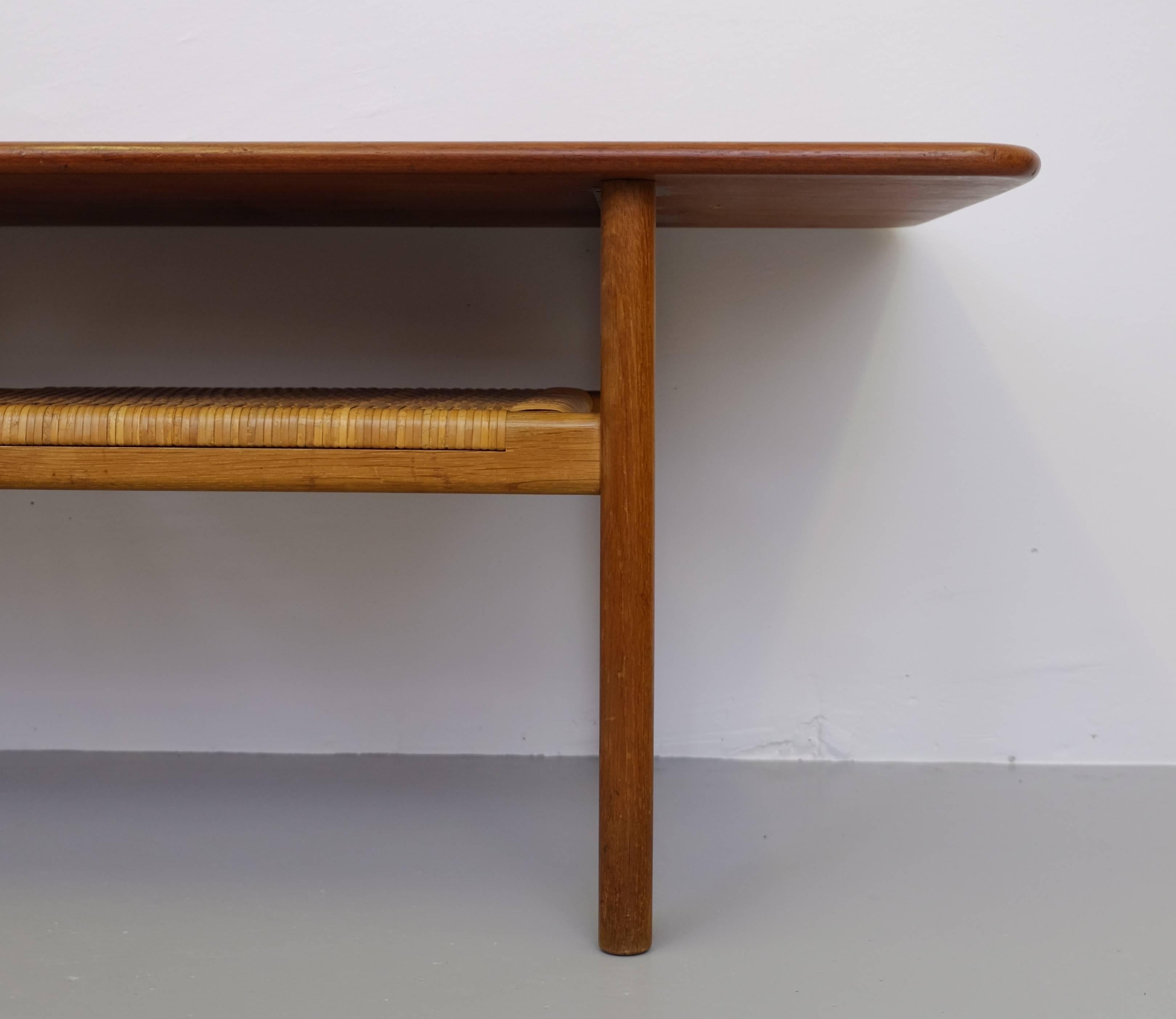 Coffee table model AT-10 design Hans J. Wegner.
Teak and cane, produced by Andreas Tuck in Denmark, 1950s.