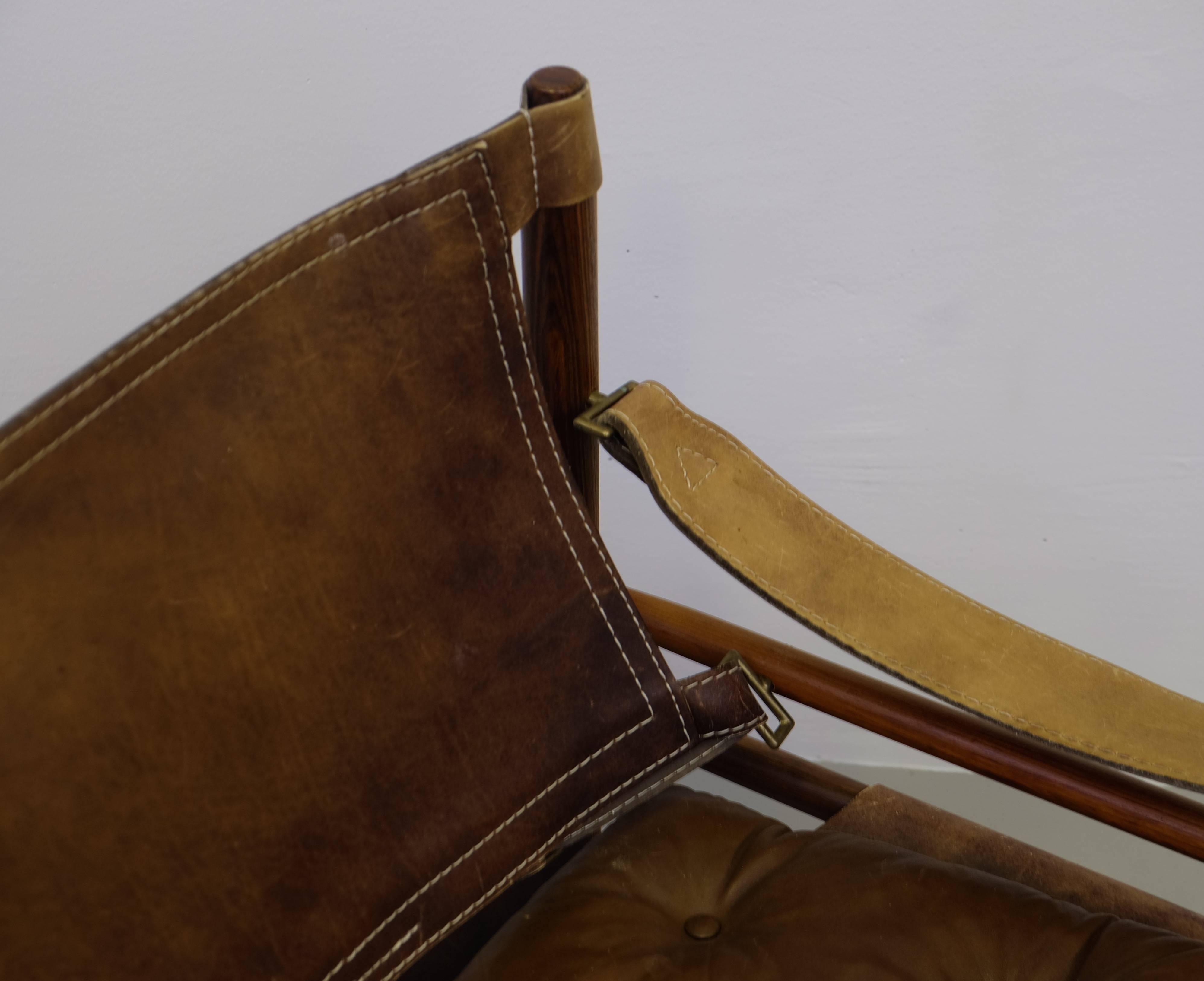 Fantastic safari chair in rosewood and brown leather. Designed by Arne Norell, produced by Arne Norell Möbel AB in Aneby, Sweden, 1960s.