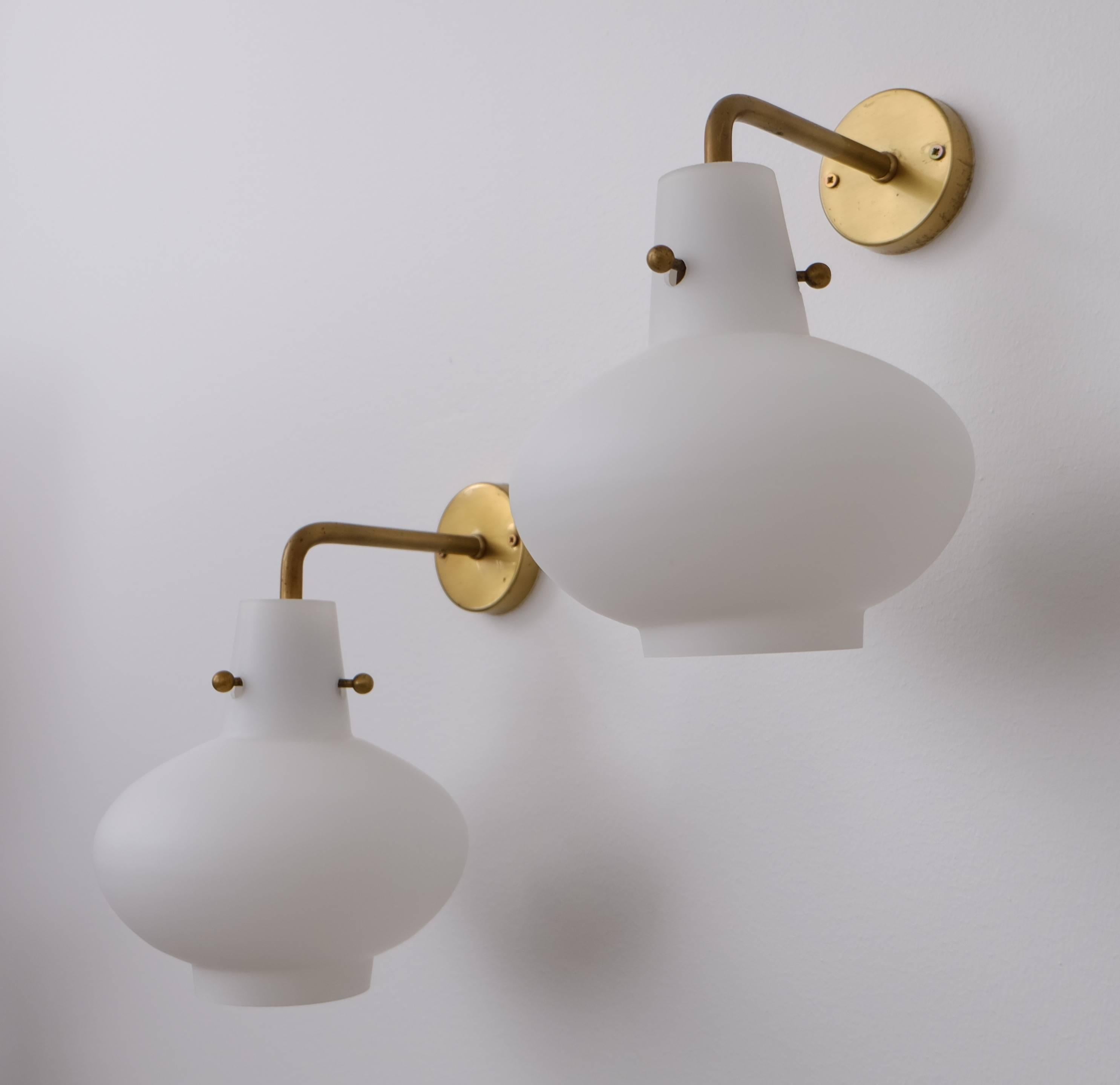 Model 407. Produced by Ateljé Lyktan, Åhus, Sweden.
Designed by Hans Bergström. Brass and opaline glass.

Please note: Listed price is for a single wall light.

 