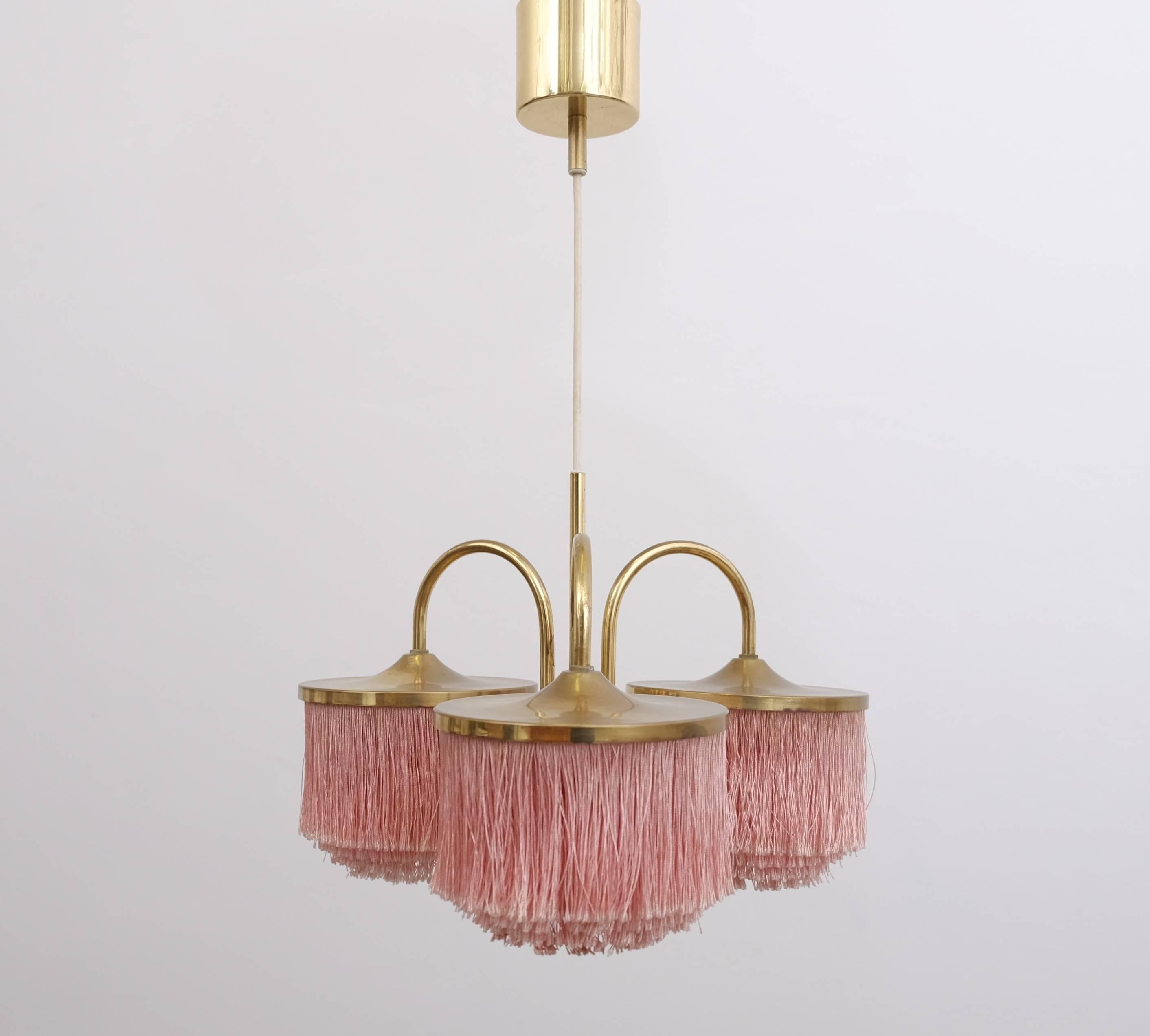 Rare three-armed Hans-Agne Jakobsson pendant with pink fringes.
Produced by Hans-Agne Jakobsson in Markaryd, Sweden, 1960s.
