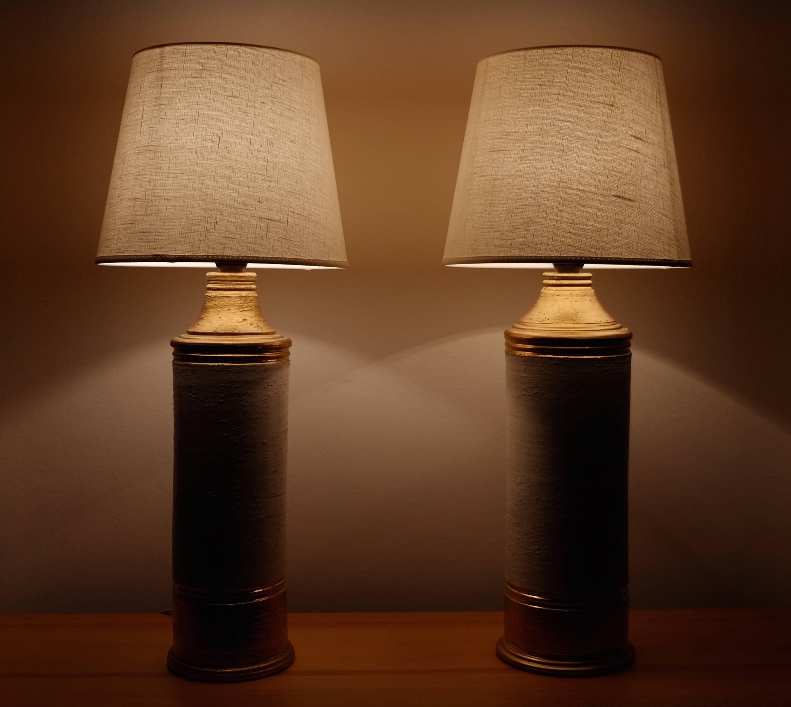 Pair of matte gold glazed ceramic lamps with a 