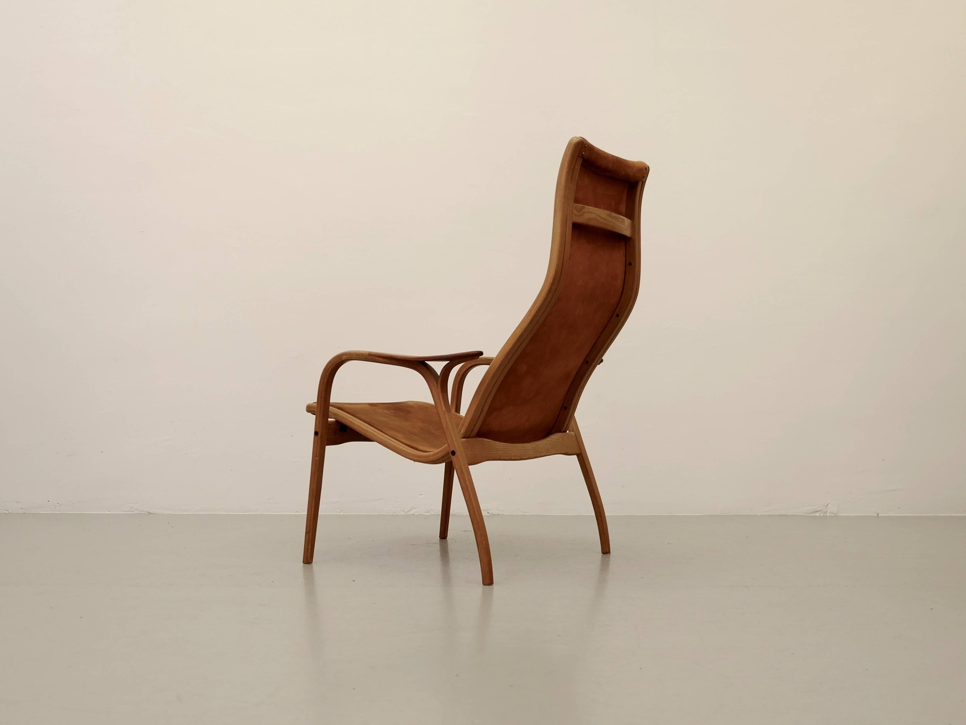 Scandinavian Modern Lamino chair by Yngve Ekström for Swedese. This piece is from 1964. This chair features bentwood teak construction with suede upholstery.