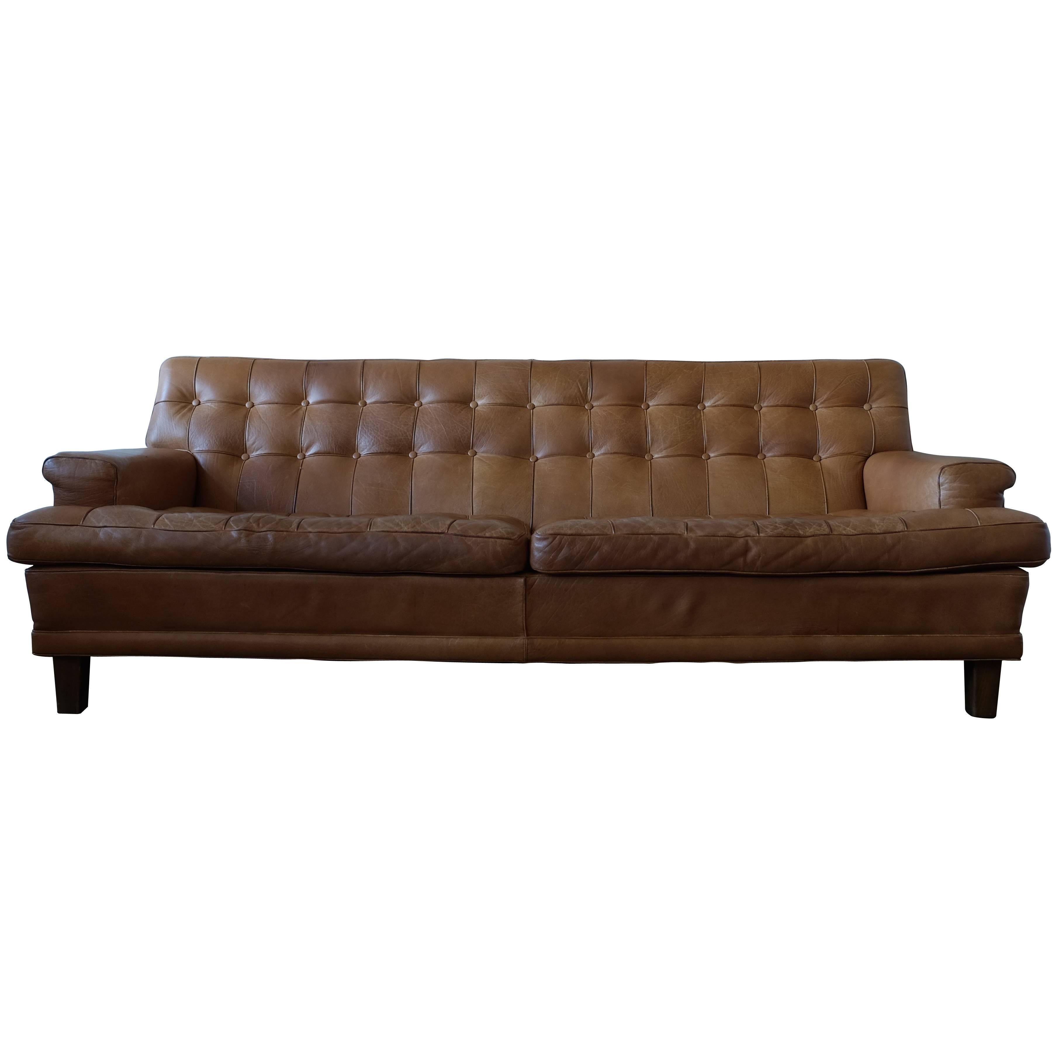 This fantastic sofa is designed by Arne Norell and produced by Arne Norell Möbler, Sweden.
Dark stained beech and cognac brown buffalo leather. Good condition with nice patina.