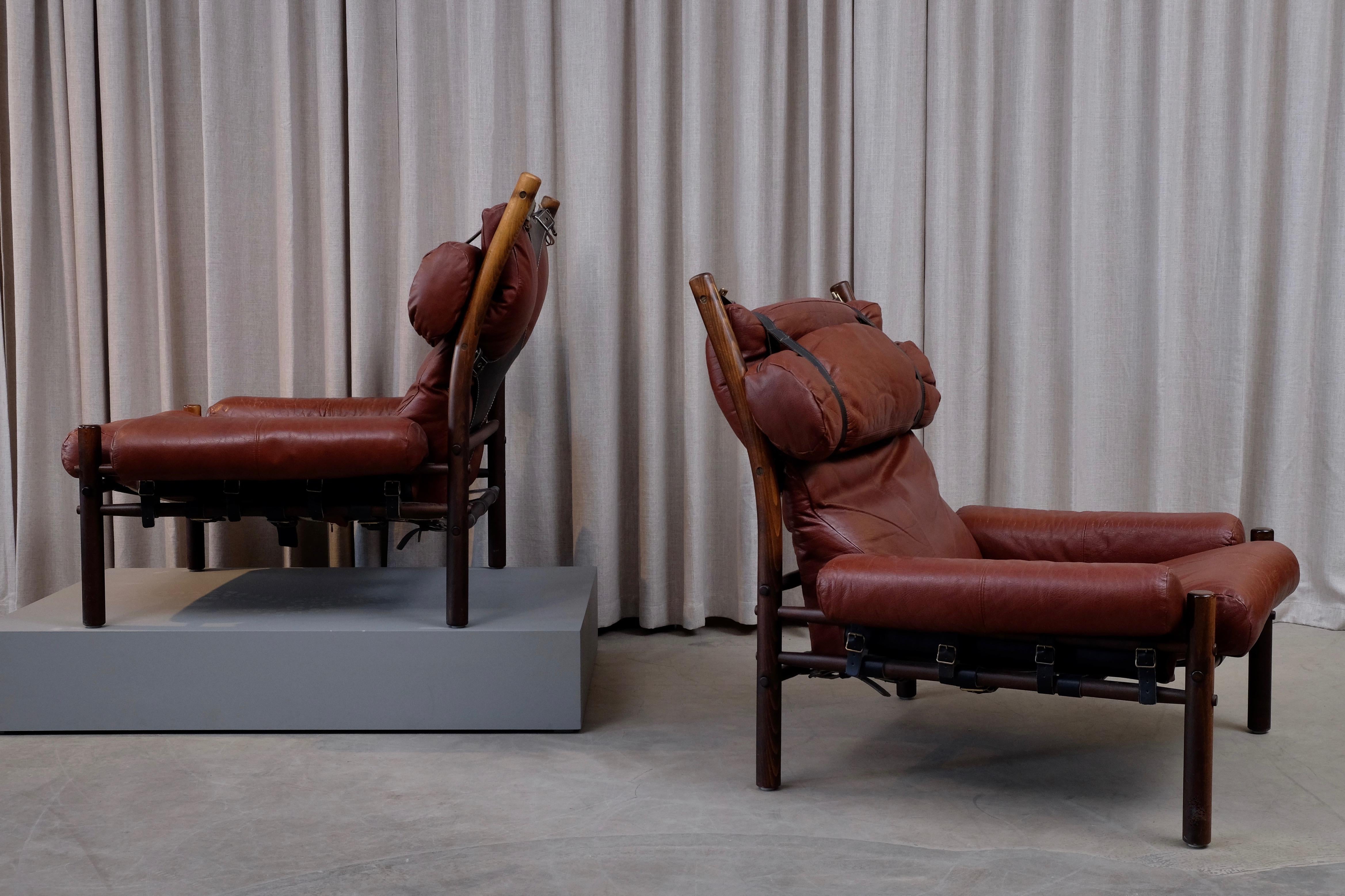 A pair of Inca chairs in patinated original buffalo rusty brown / black leather.
Designed by Arne Norell, produced by Norell Möbel AB in Aneby, Sweden. Signed.





  